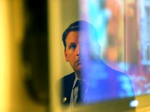 Gardner Museum security director Anthony Amore was reflected in a TV screen as he showed evidence in the ongoing investigation.