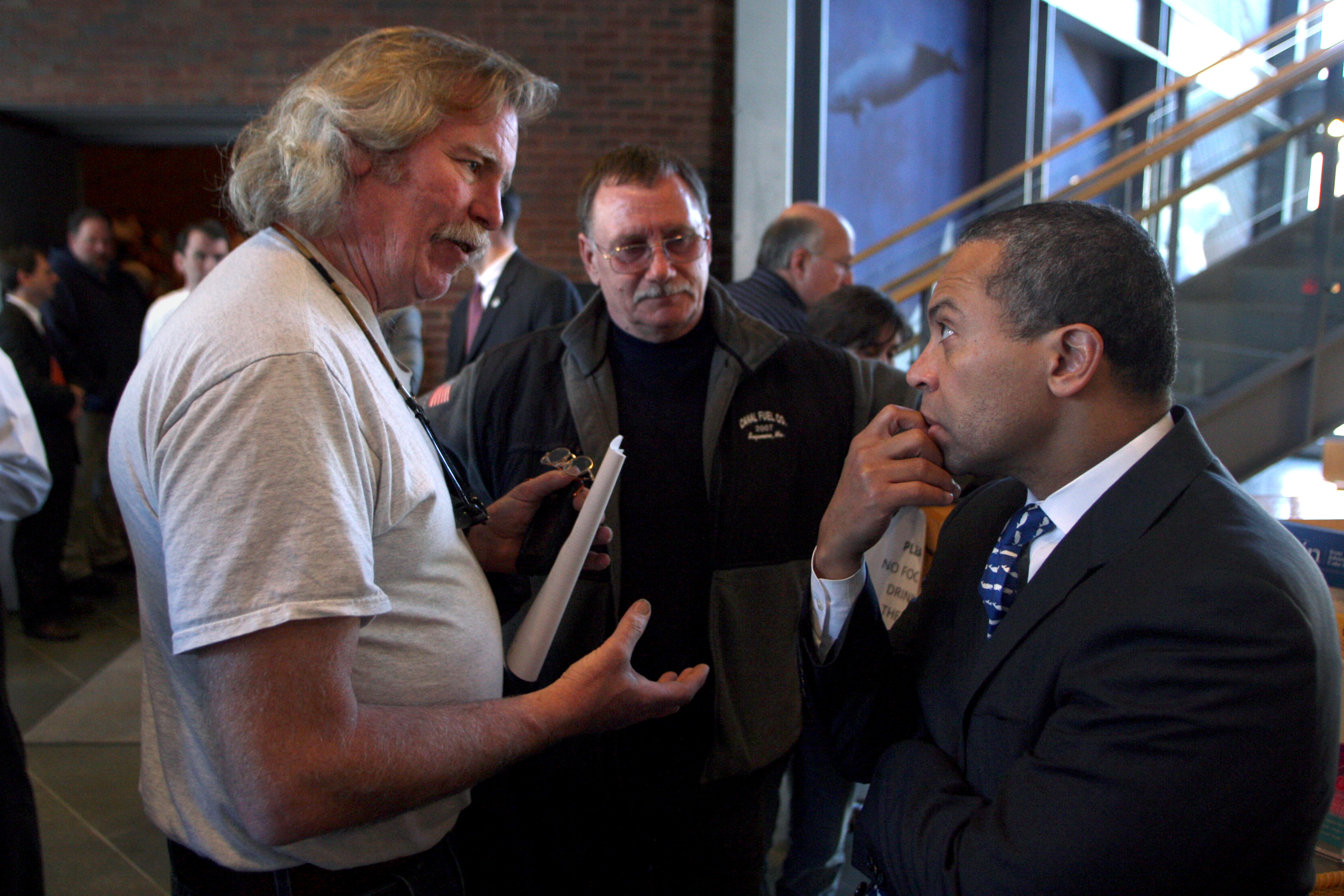 Gov. Deval Patrick listened as Plymouth commercial fisherman Ed Barrett expressed his concern over the Cape Wind project on the fishery during the Northeastern Fisheries Summit in 2010.