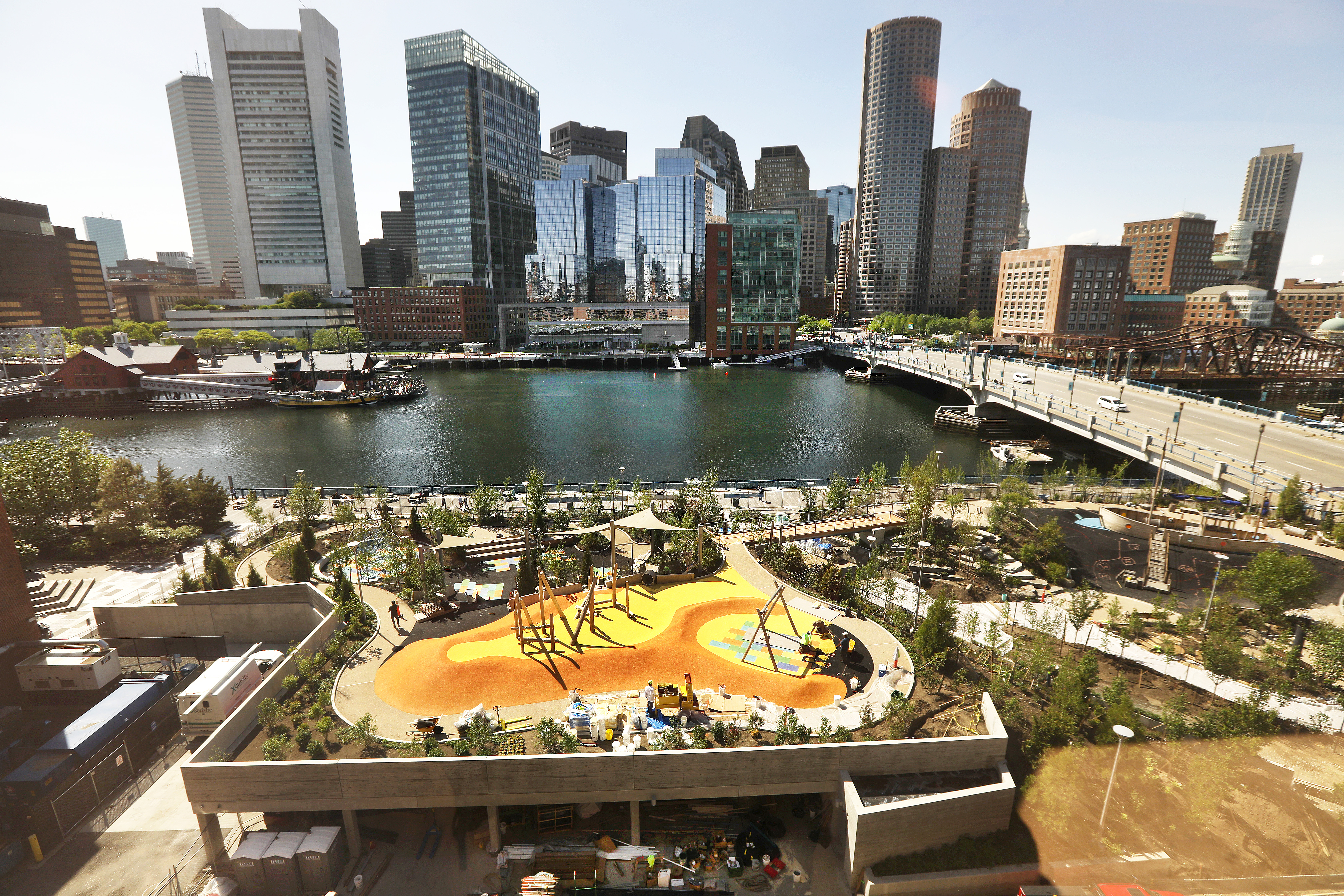 The park sits next to the Fort Point Channel, with a view of downtown Boston.