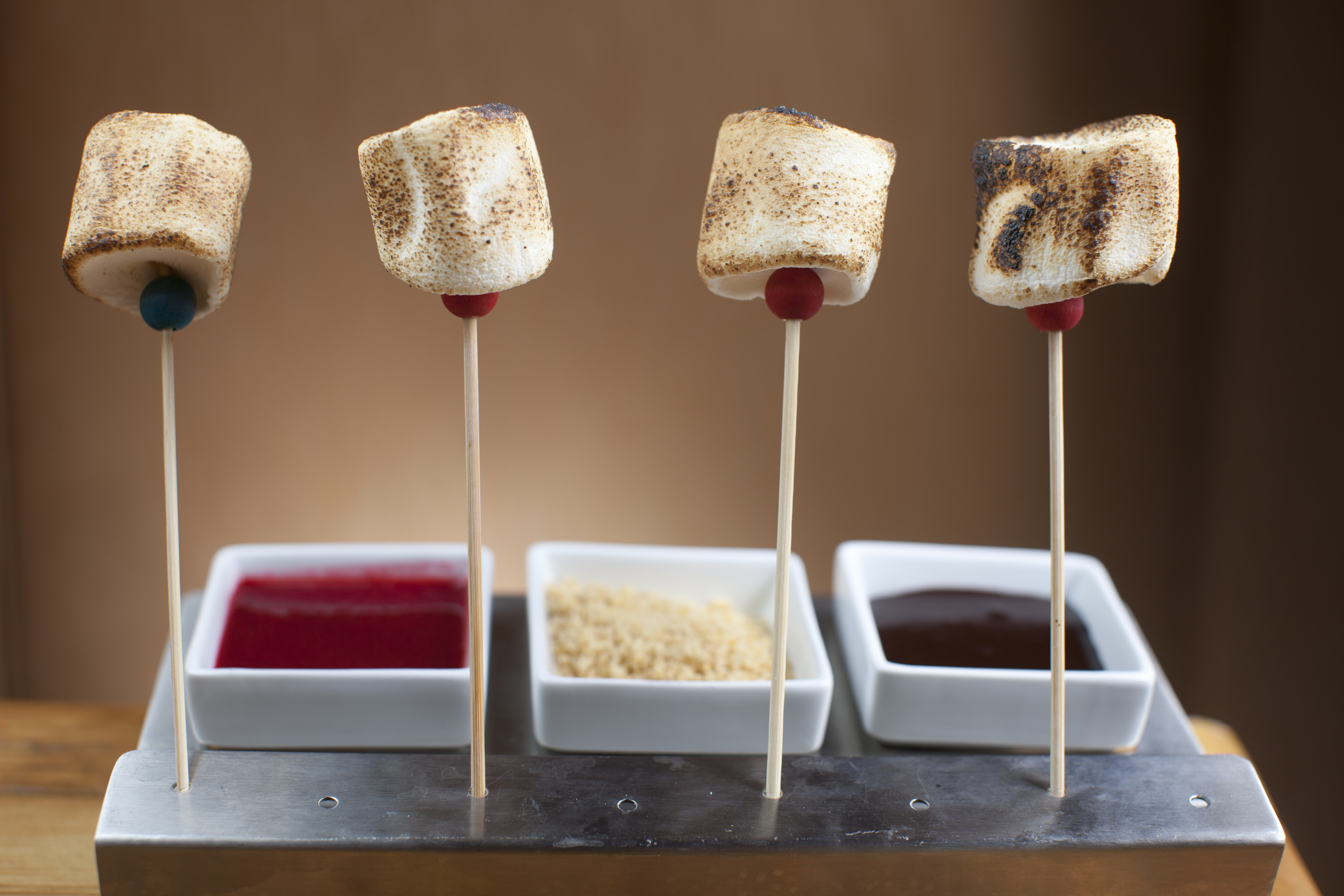 S’more sticks featuring skewered toasted marshmallows.