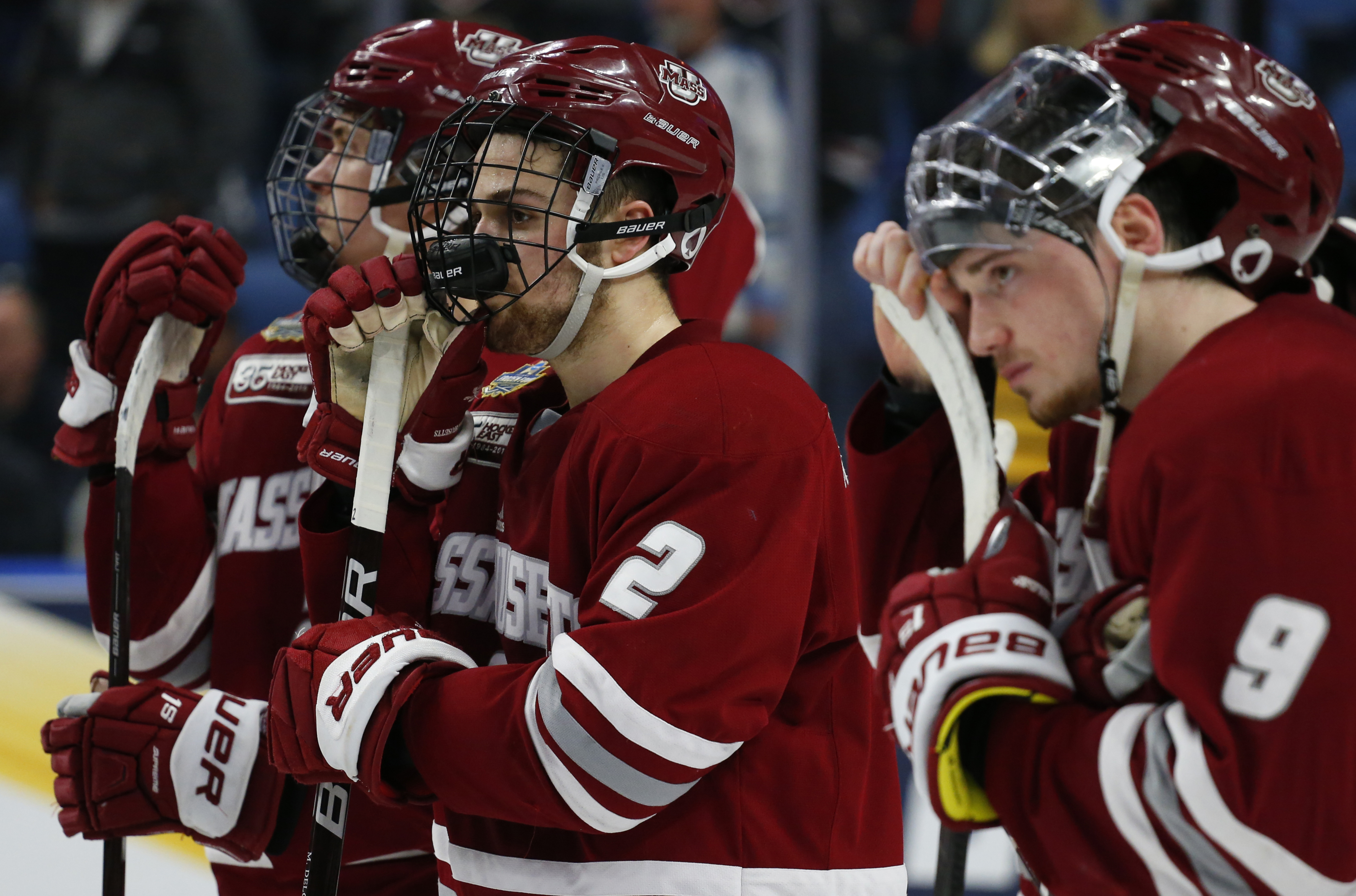 UMass players can’t hide their disappointment after losing to Minnesota Duluth in the NCAA men’s hockey championship game.