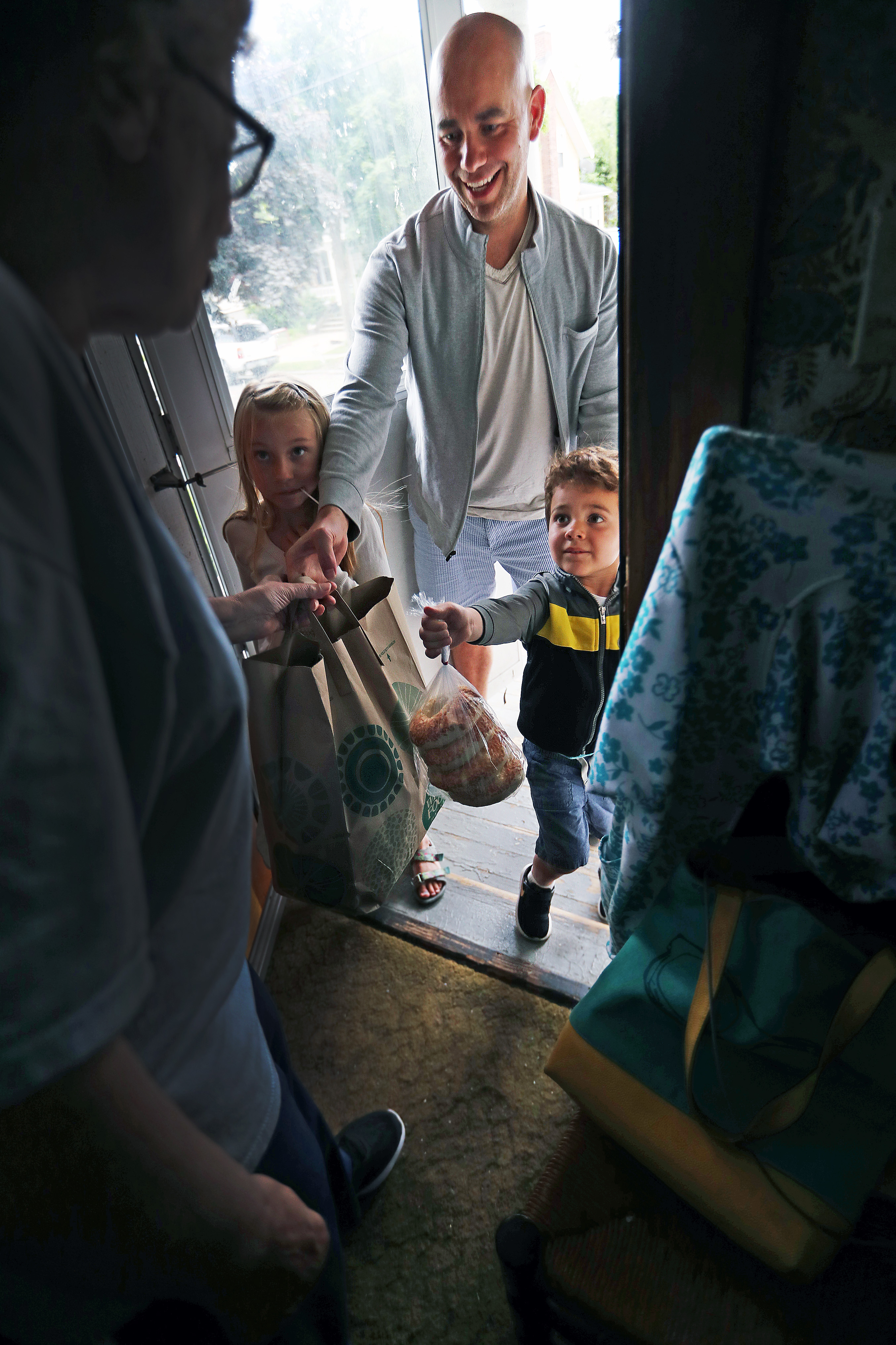 Carson delivered food with his daughter Stella and his son Roman along for the ride.
