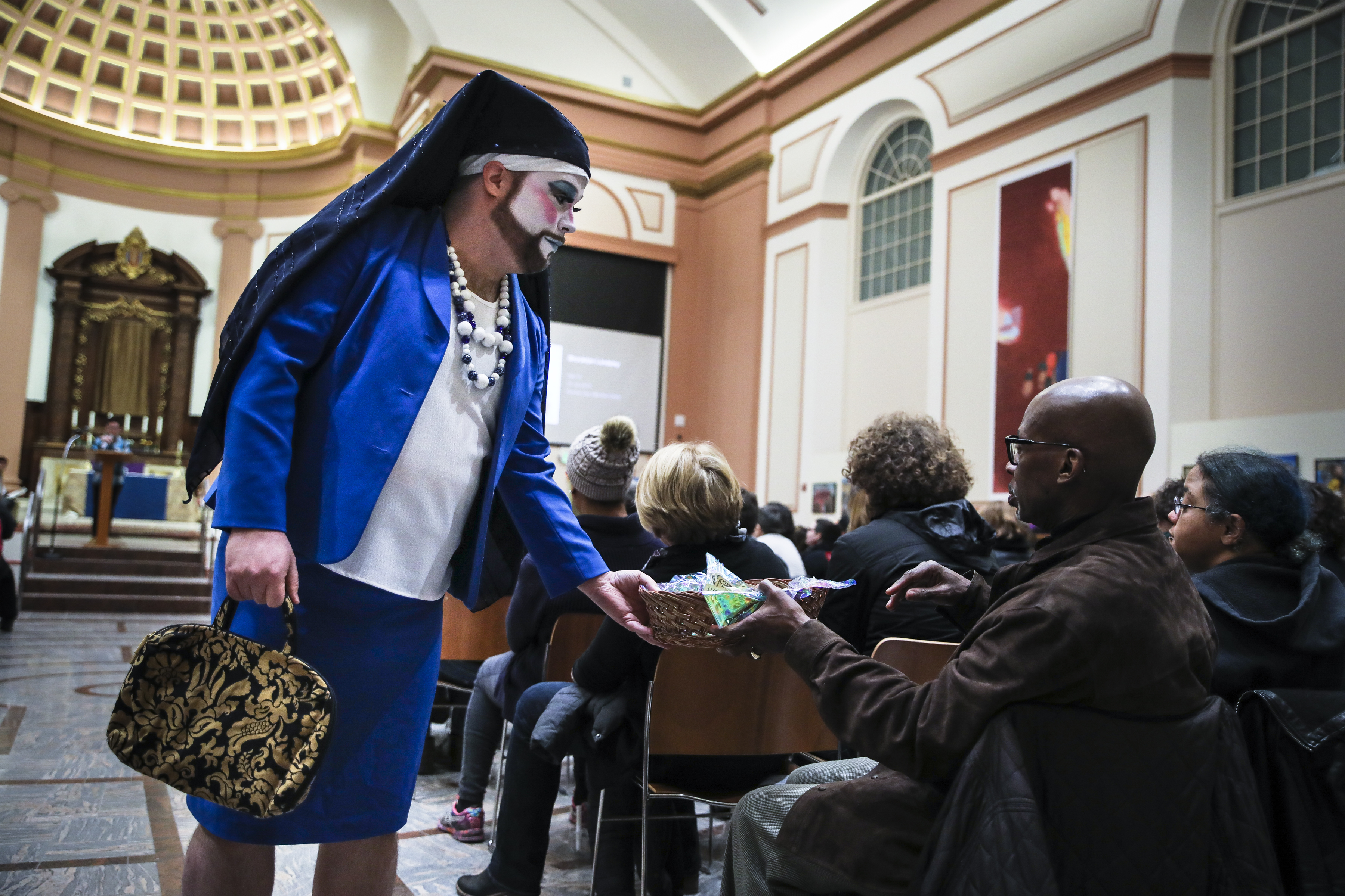 Sister Gloria LeLulia of The Boston Sisters of Perpetual Indulgence handed donation baskets to audience members.