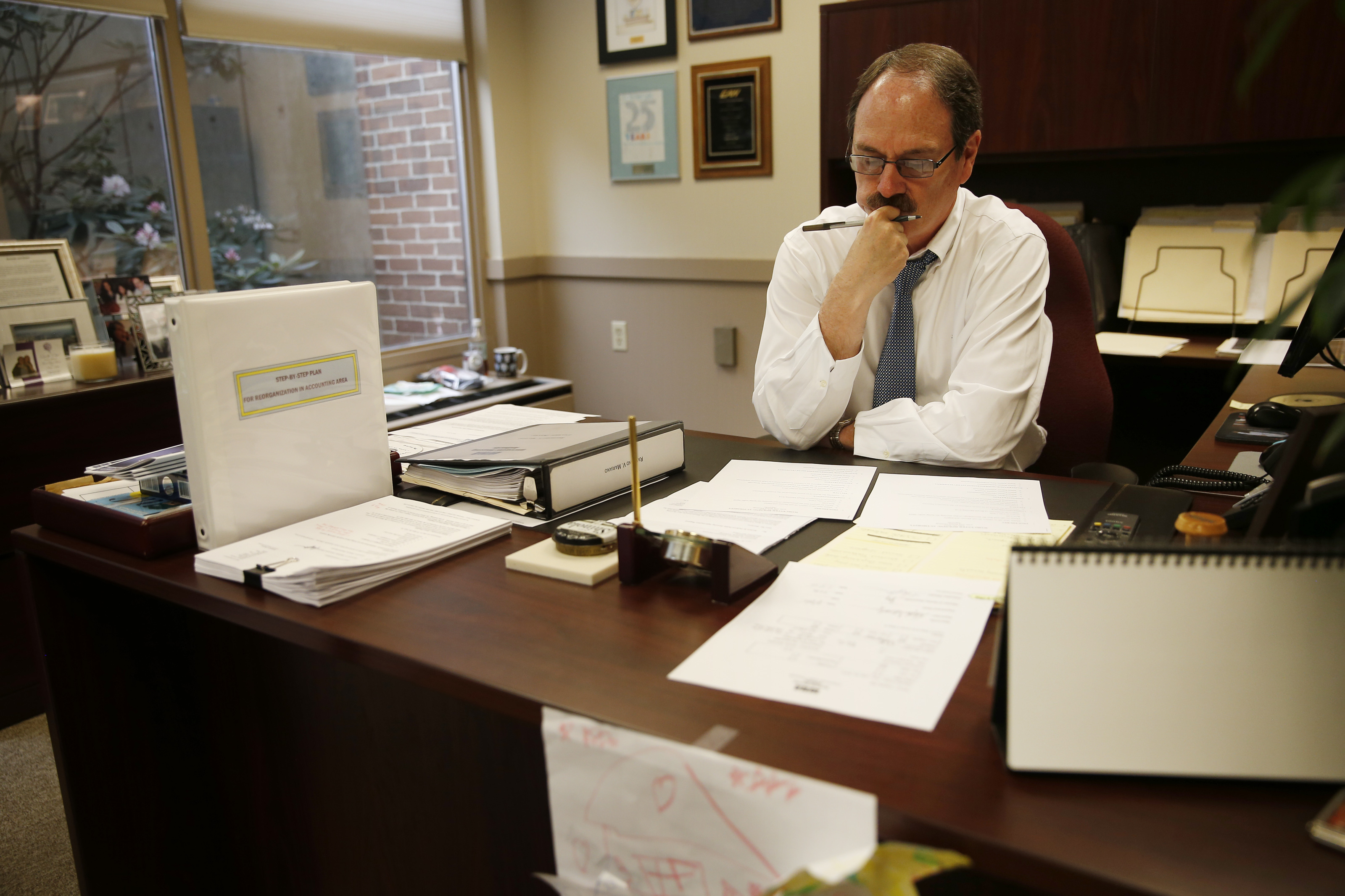 Mariano in his housing authority office, where he oversees more than 6,600 units on 24 properties.