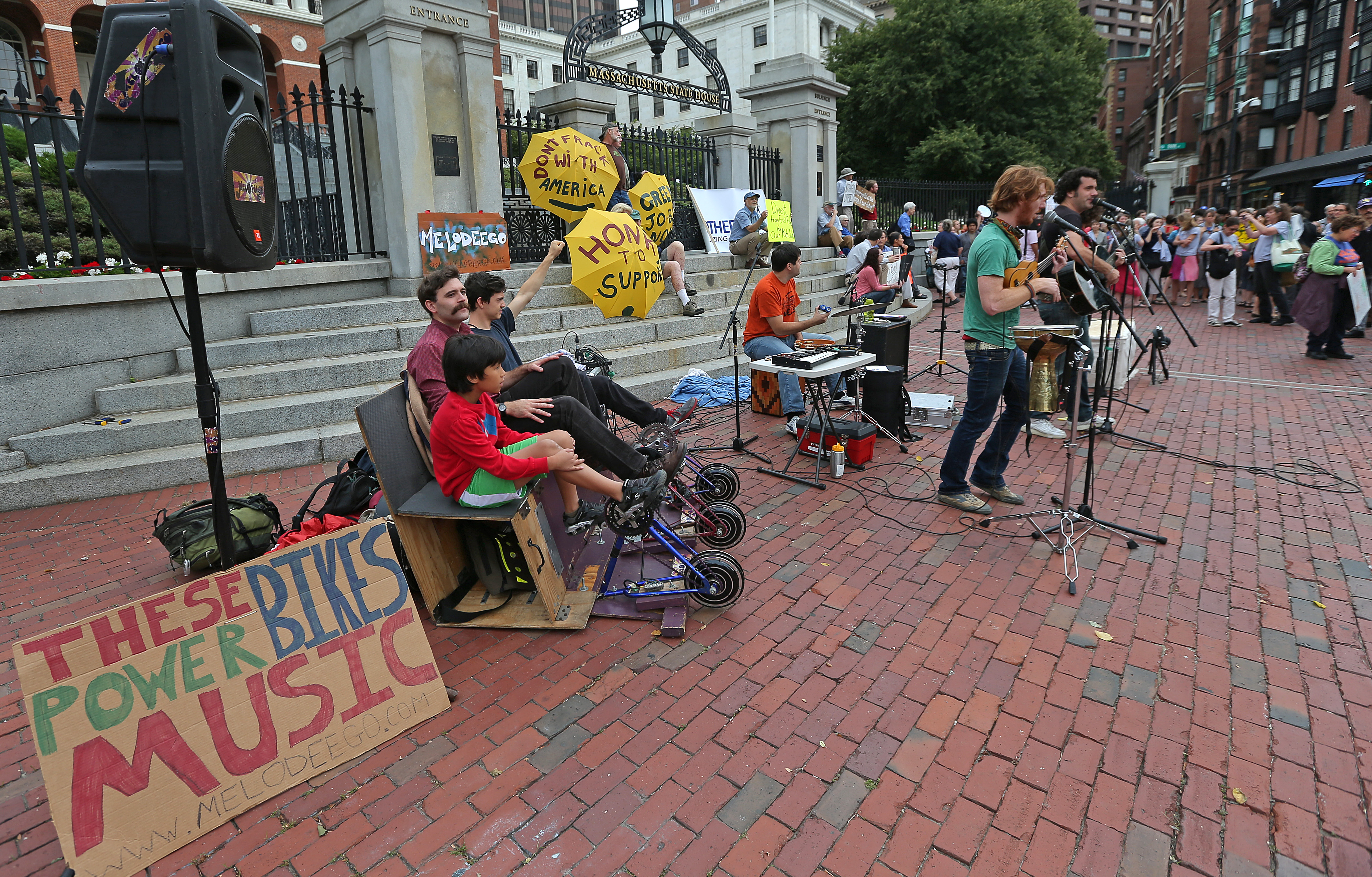 Activists rallied outside the State House Tuesday as lawmakers held a hearing on a bill that would divest the state pension fund from companies that are involved in fossil fuels, considered the main culprit in climate change.