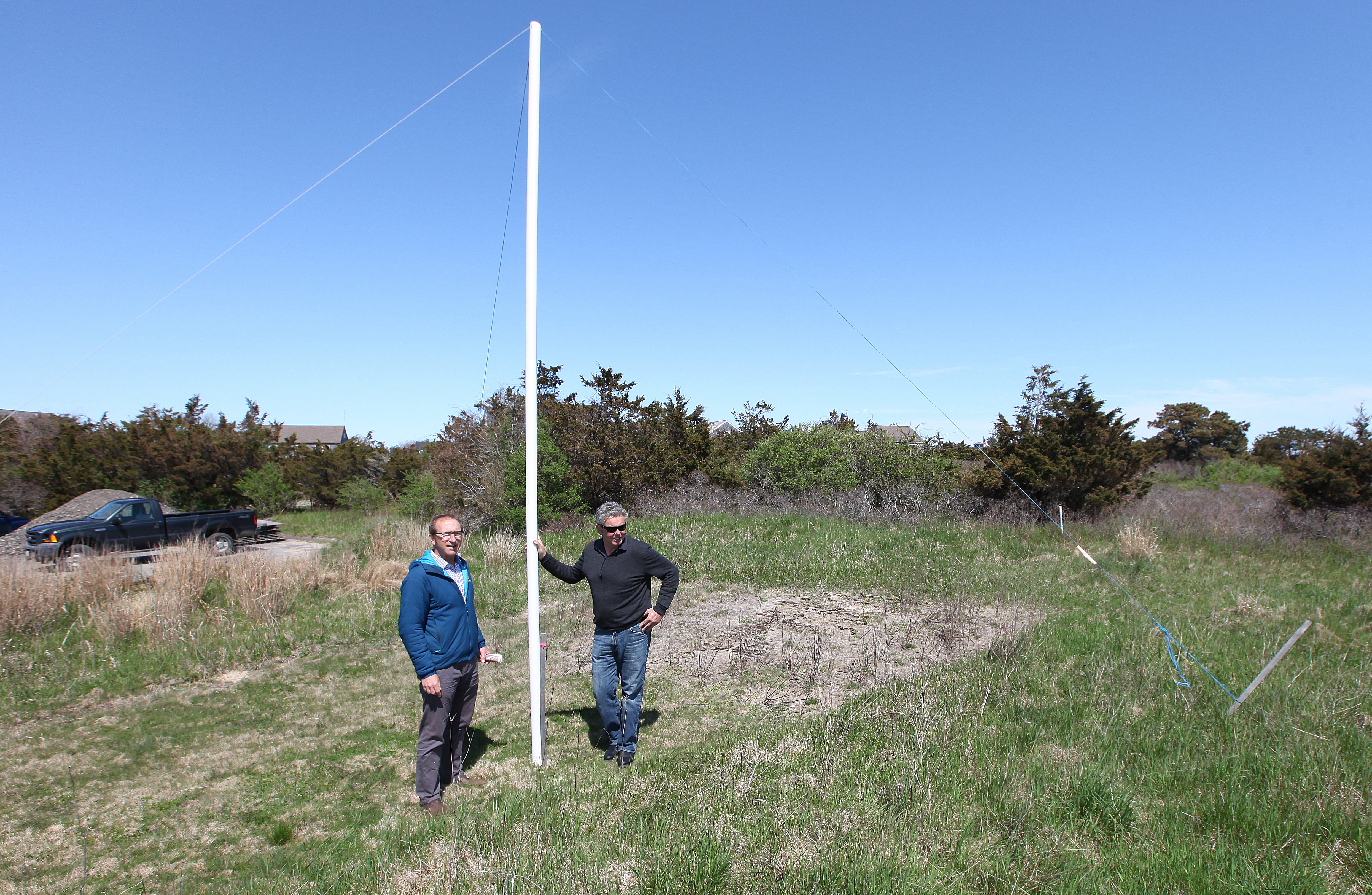 Eric Savetsky and Neil Paterson stood at one end of the proposed footprint of the building planned.