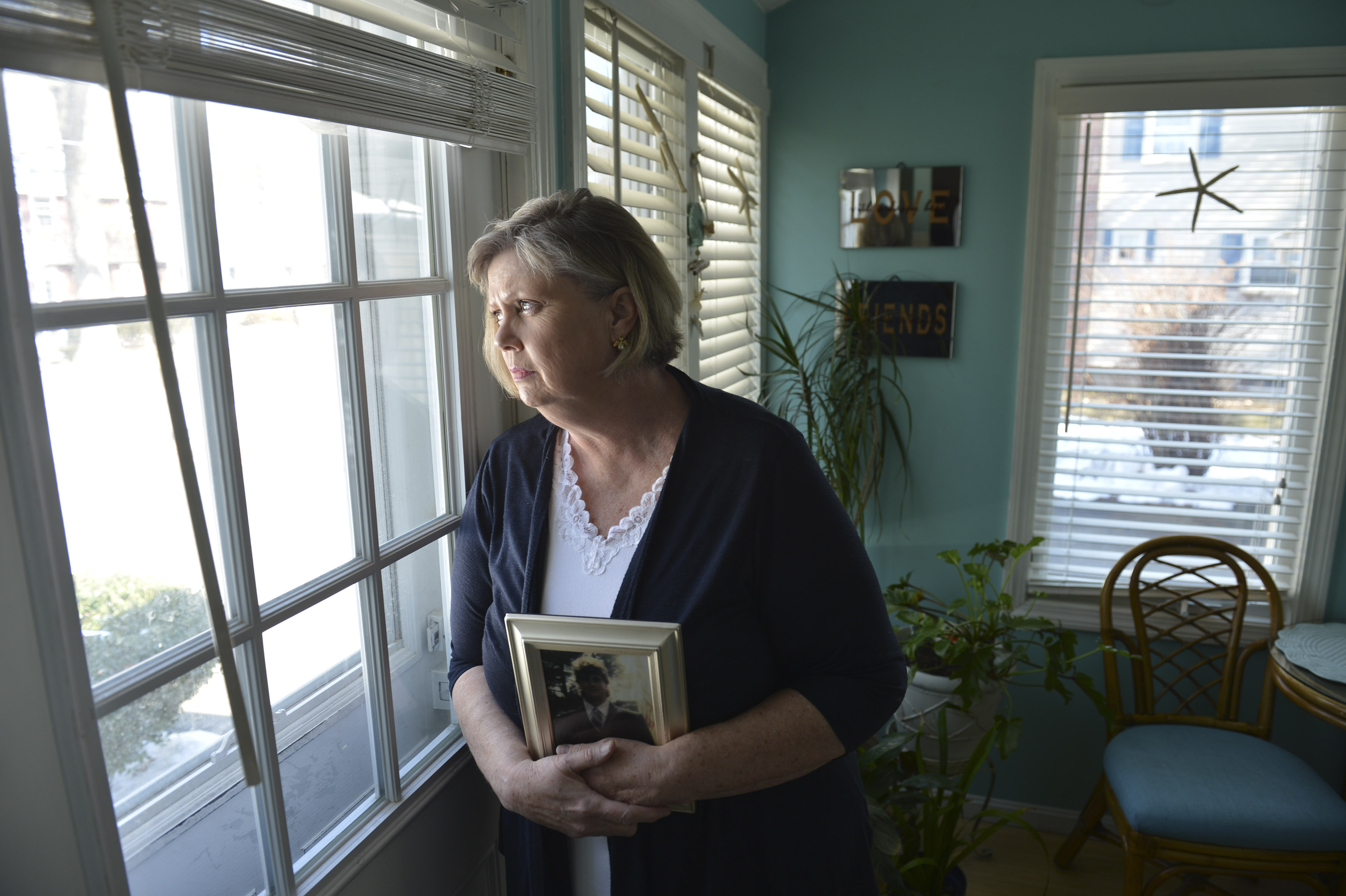 Karen Citrano holds a photograph of her son, Edward Sullivan, who was murdered by then 17-year-old Steven James in 1994. She learned this winter that because of a change in the law, James could get out on parole.