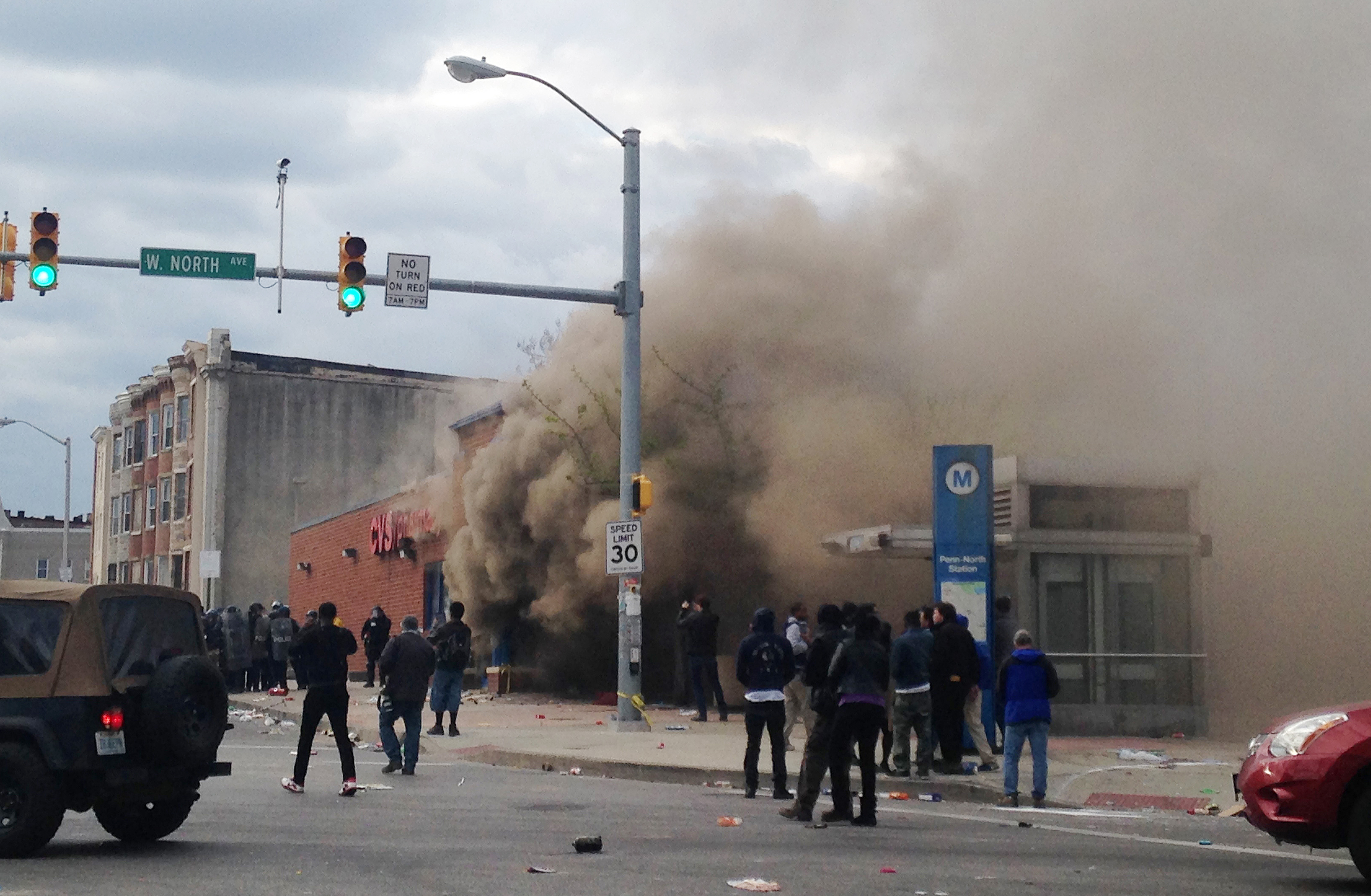 Smoke billowed from a CVS Pharmacy store in Baltimore on Monday.