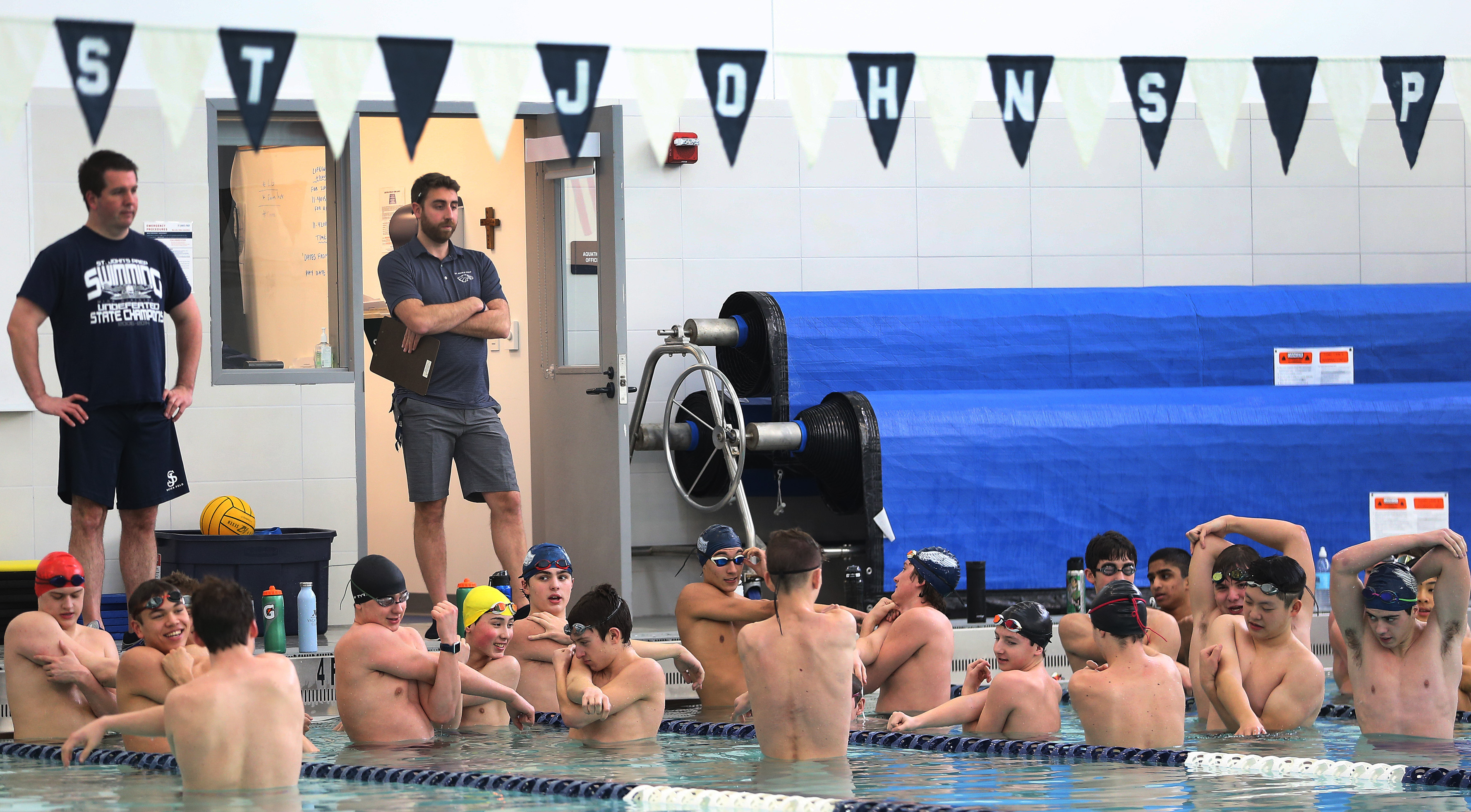 Jeff Fiore, center, at St. John’s Prep practice on Thursday.