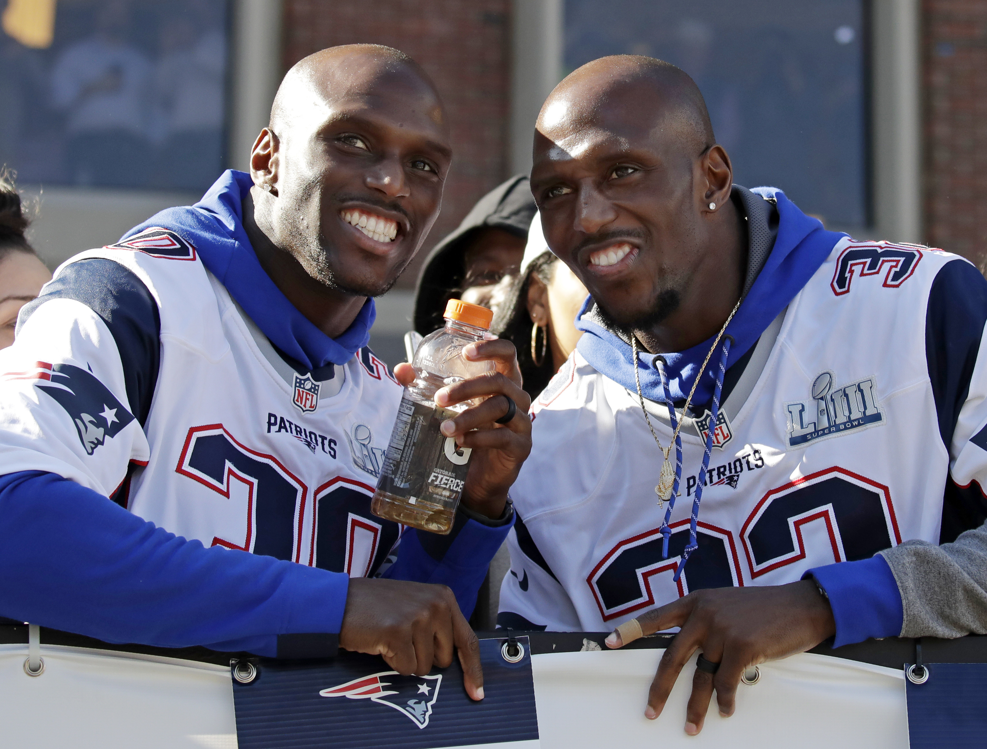 Jason McCourty (left) and his brother Devin celebrated the Patriots’ Super Bowl win during Tuesday’s victory parade.