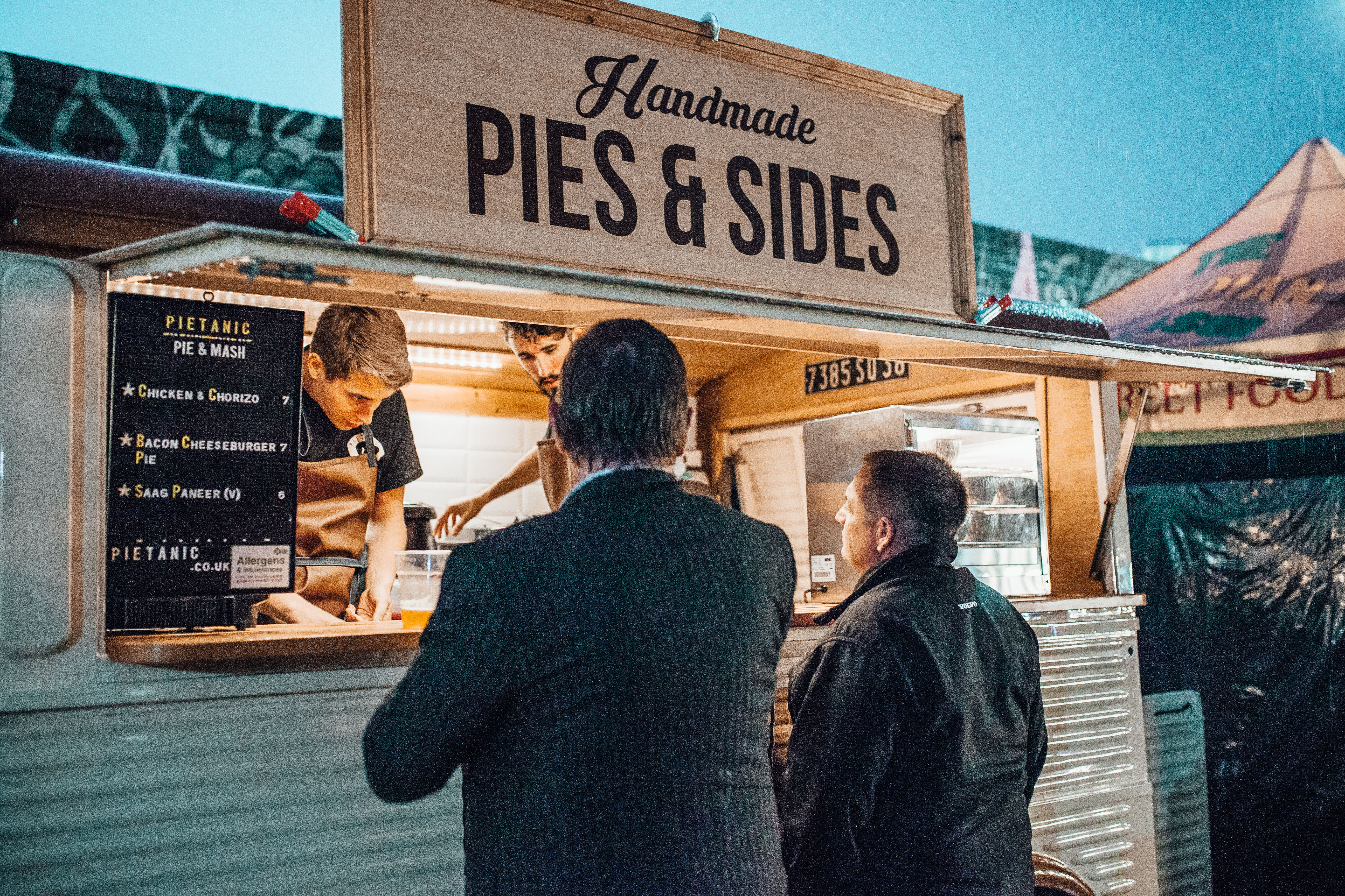 Patrons at one of the food carts that make up the Digbeth Dining Club, in an old industrial neighborhood of Birmingham.