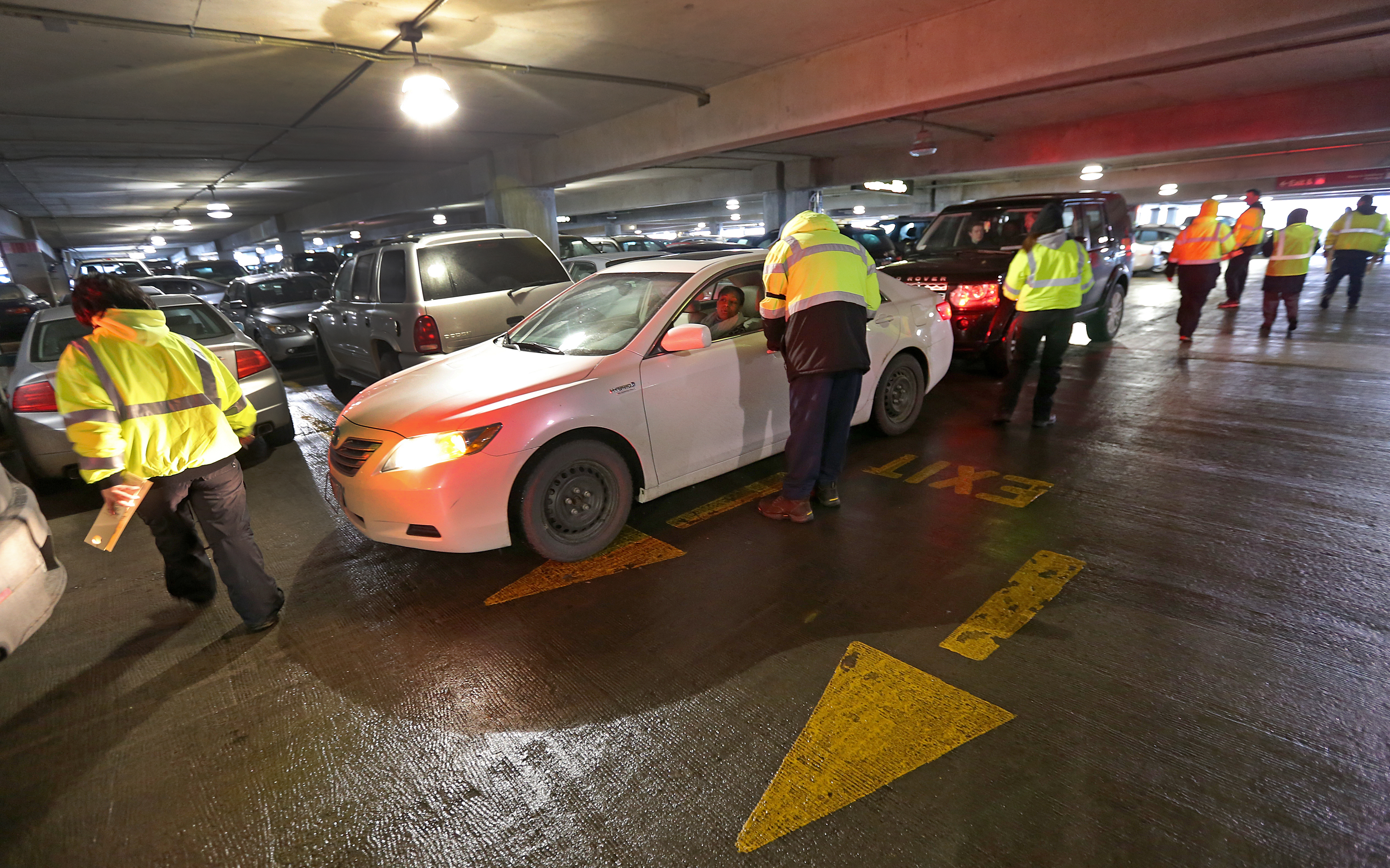 Valets help ease the school vacation week parking crunch at Logan Airport in February 2014.