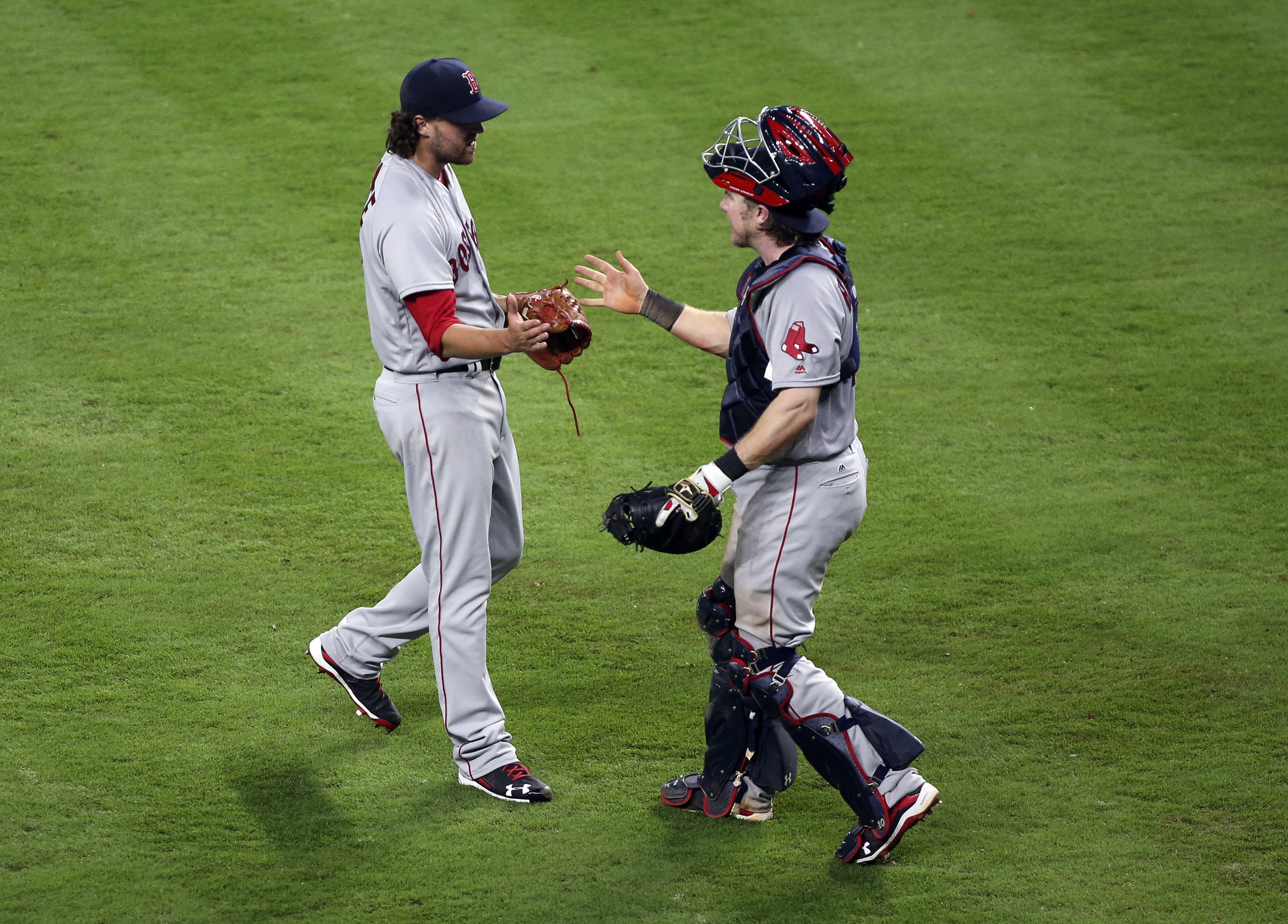Heath Hembree and catcher Ryan Hanigan celebrate their victory.