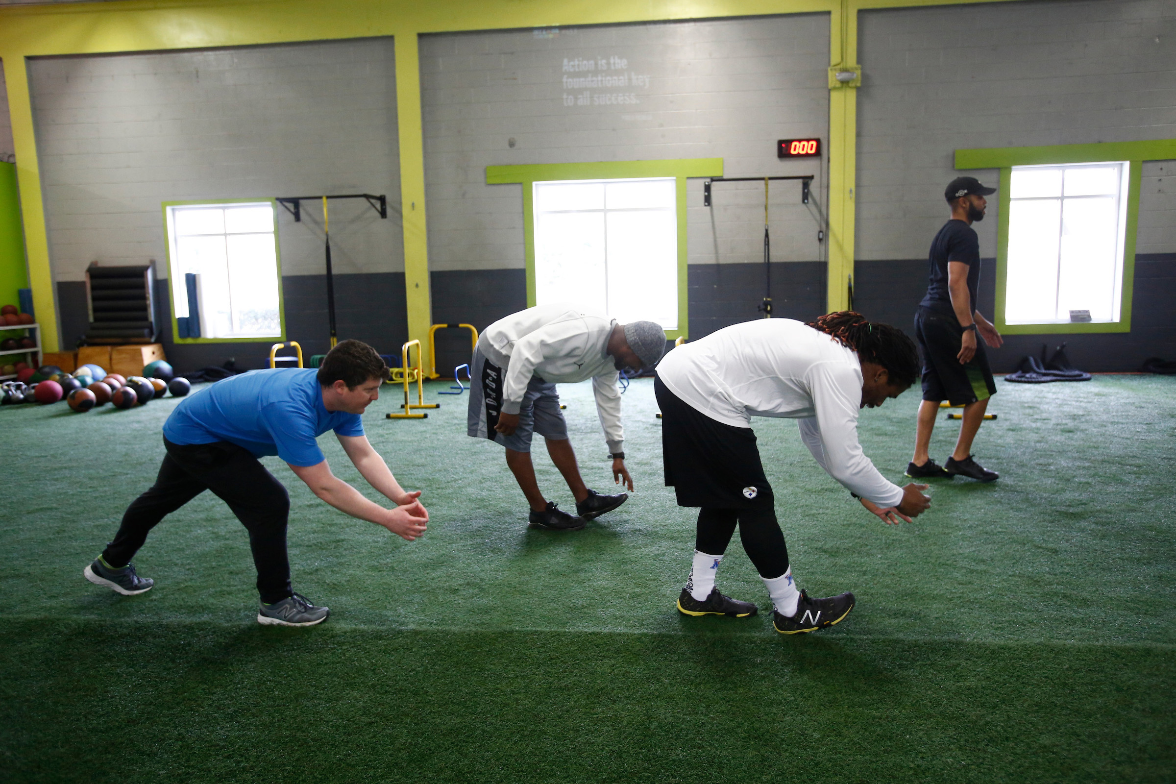 The Globe’s Ben Volin (blue shirt, undersized backup) was a full participant with some NFL players during a workout at Athlete By Design in Charlotte, N.C.