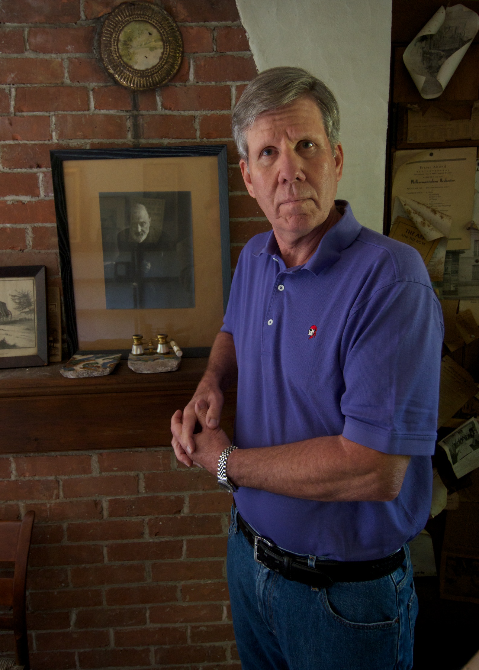 Charles Ives Tyler says that he is selling the former home of his grandfather Charles Ives (in framed photograph on mantel) because he no longer has any personal use for the property and can’t afford to keep it.
