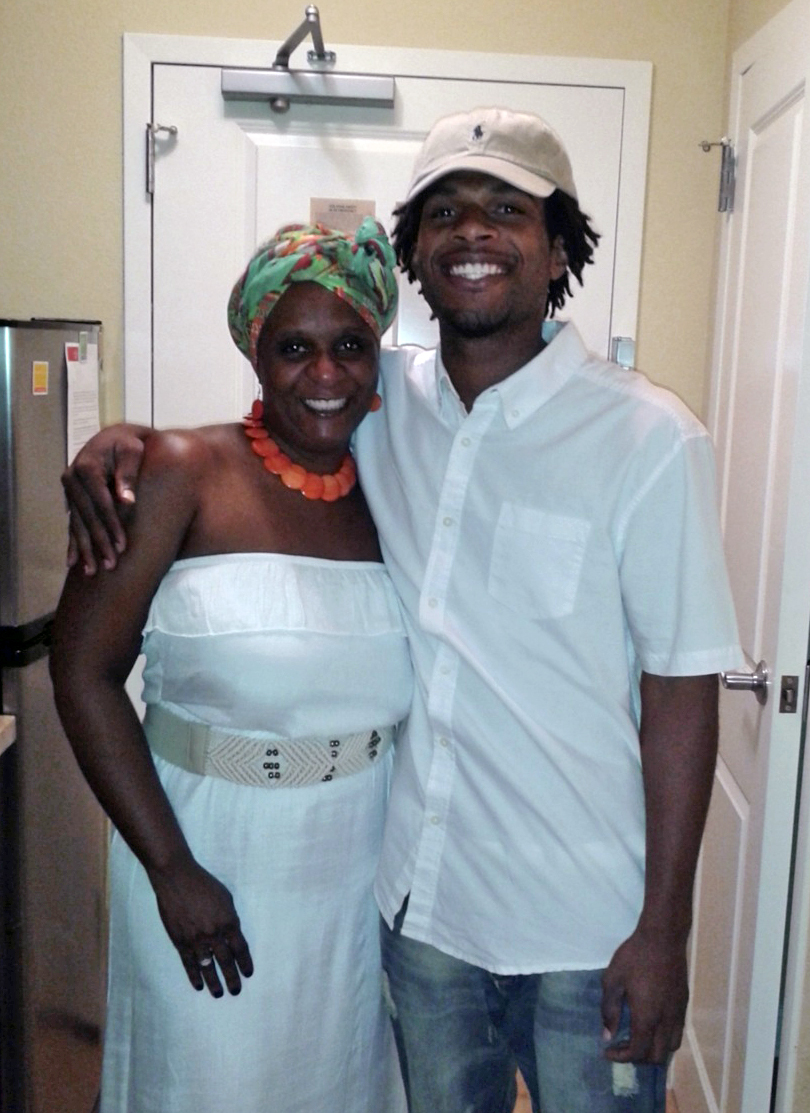 John Crawford III, shown with his mother, was fatally shot as he held an air rifle inside a Walmart.