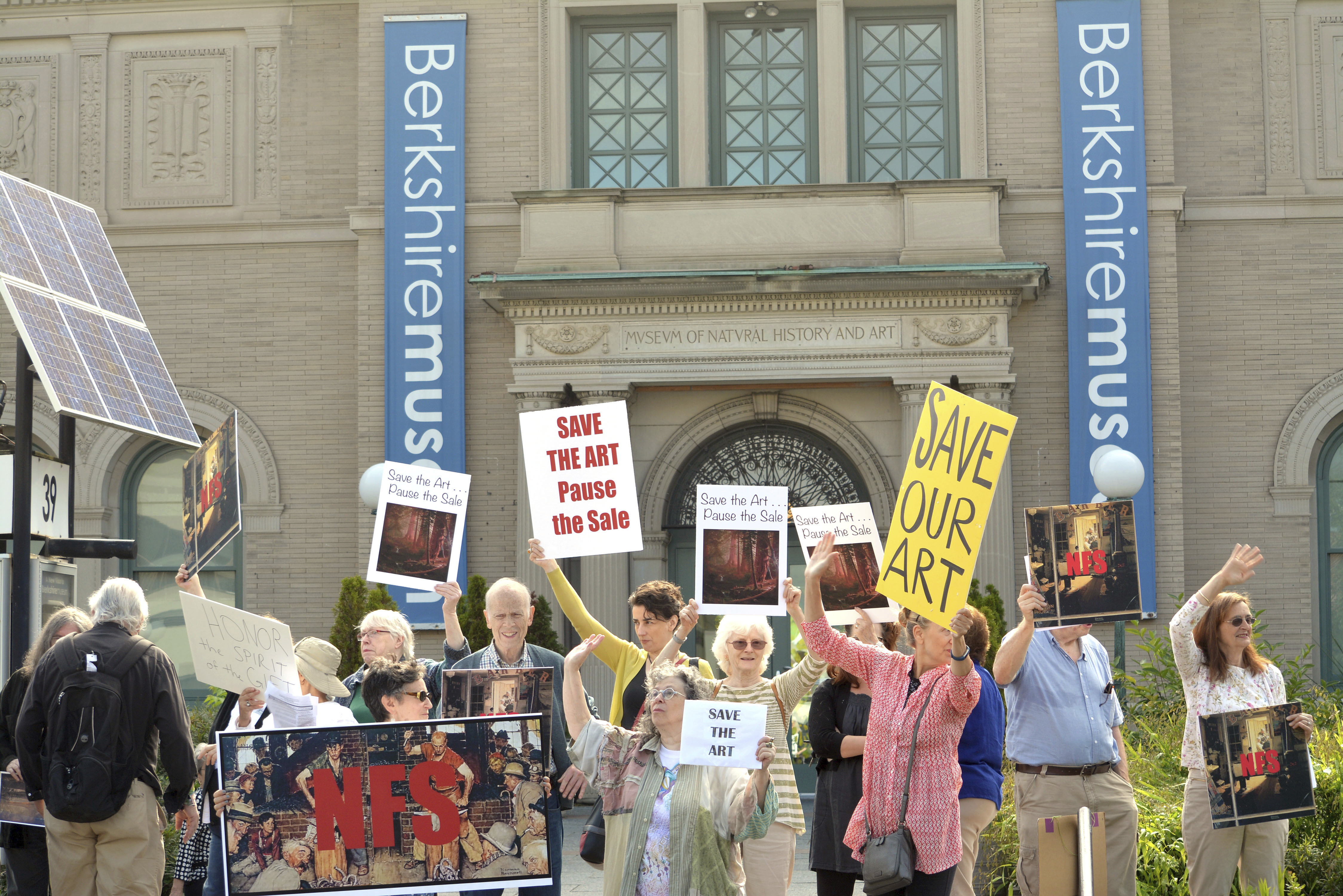 About 40 people opposed to the selling of Berkshire Museum artworks protested in front of the Pittsfield museum on Aug. 12, 2017.