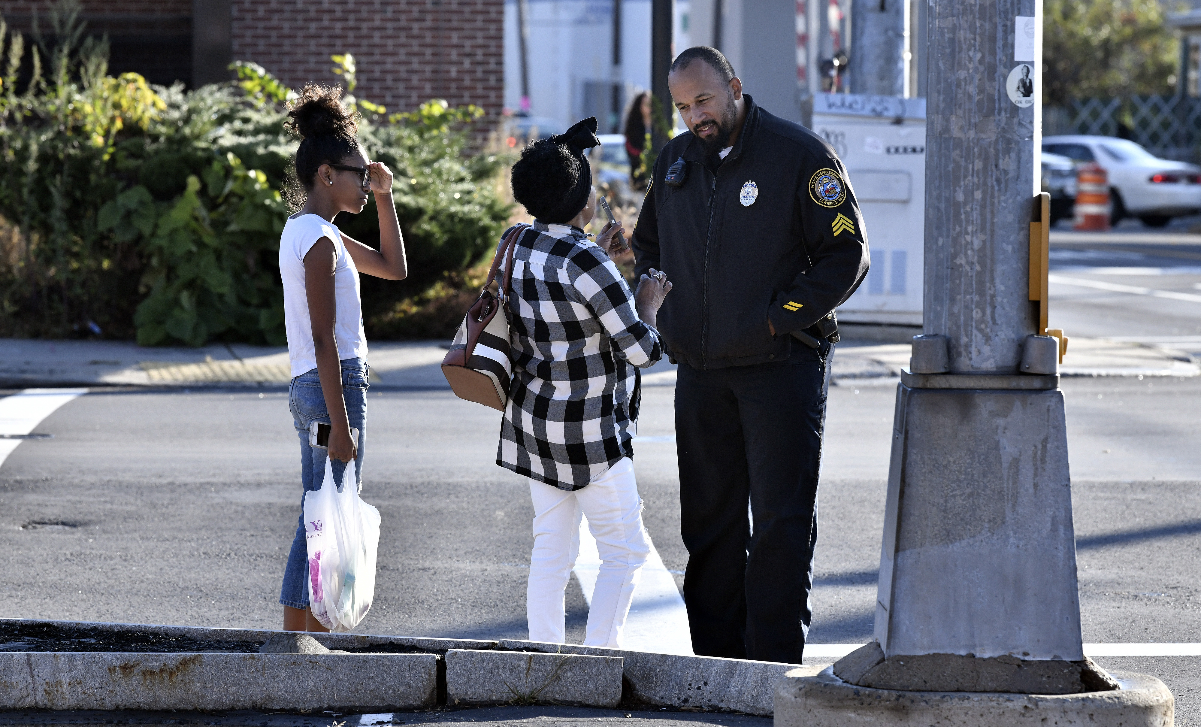 Residents asked a police officer for directions around the closed down section of South Broadway in Lawrence.