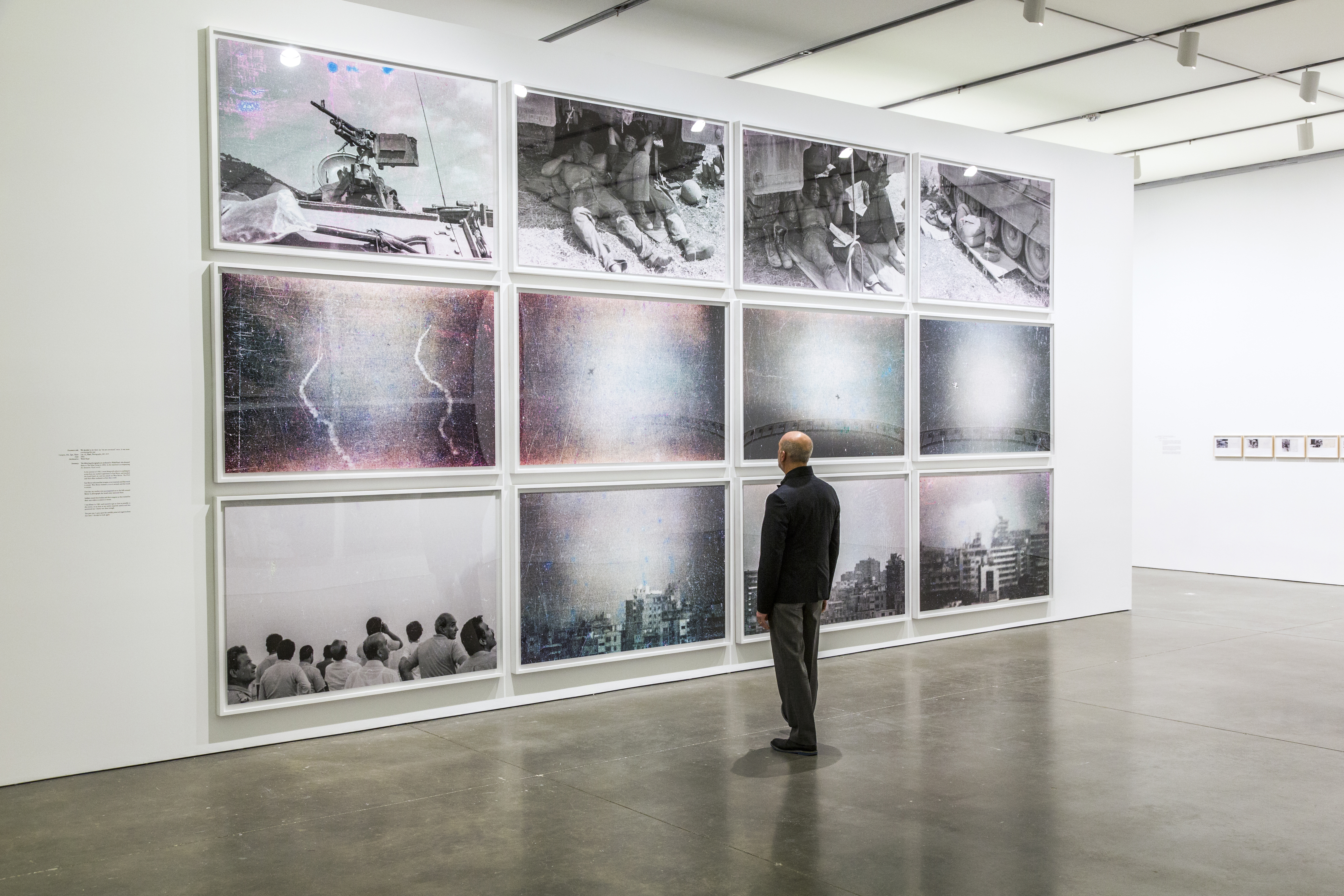 A wall of photographs in the “Walid Raad” exhibit.