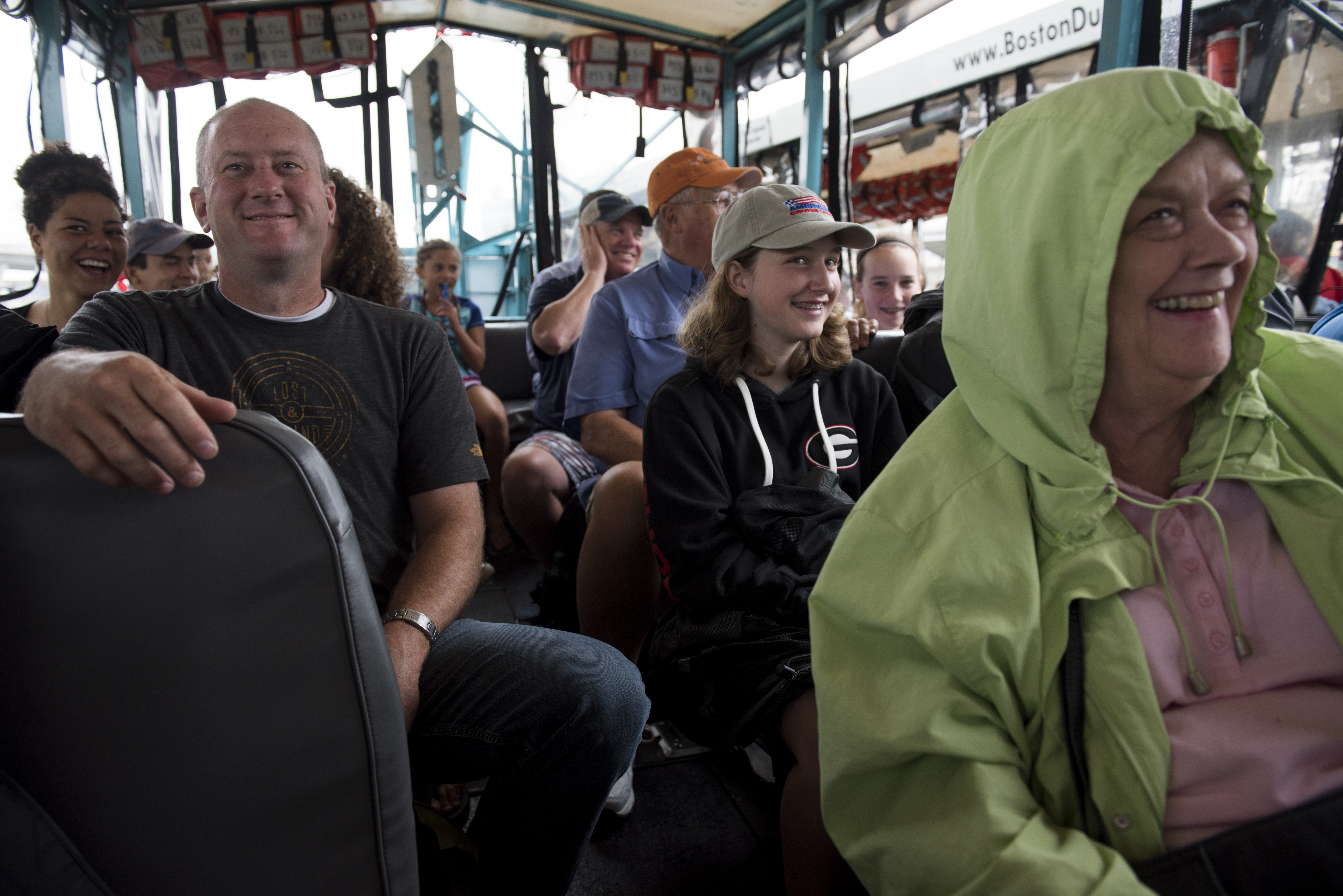 Tourists joined their tour guide in quacking at a passing fellow duck boat during a late-morning Boston Duck Tour.