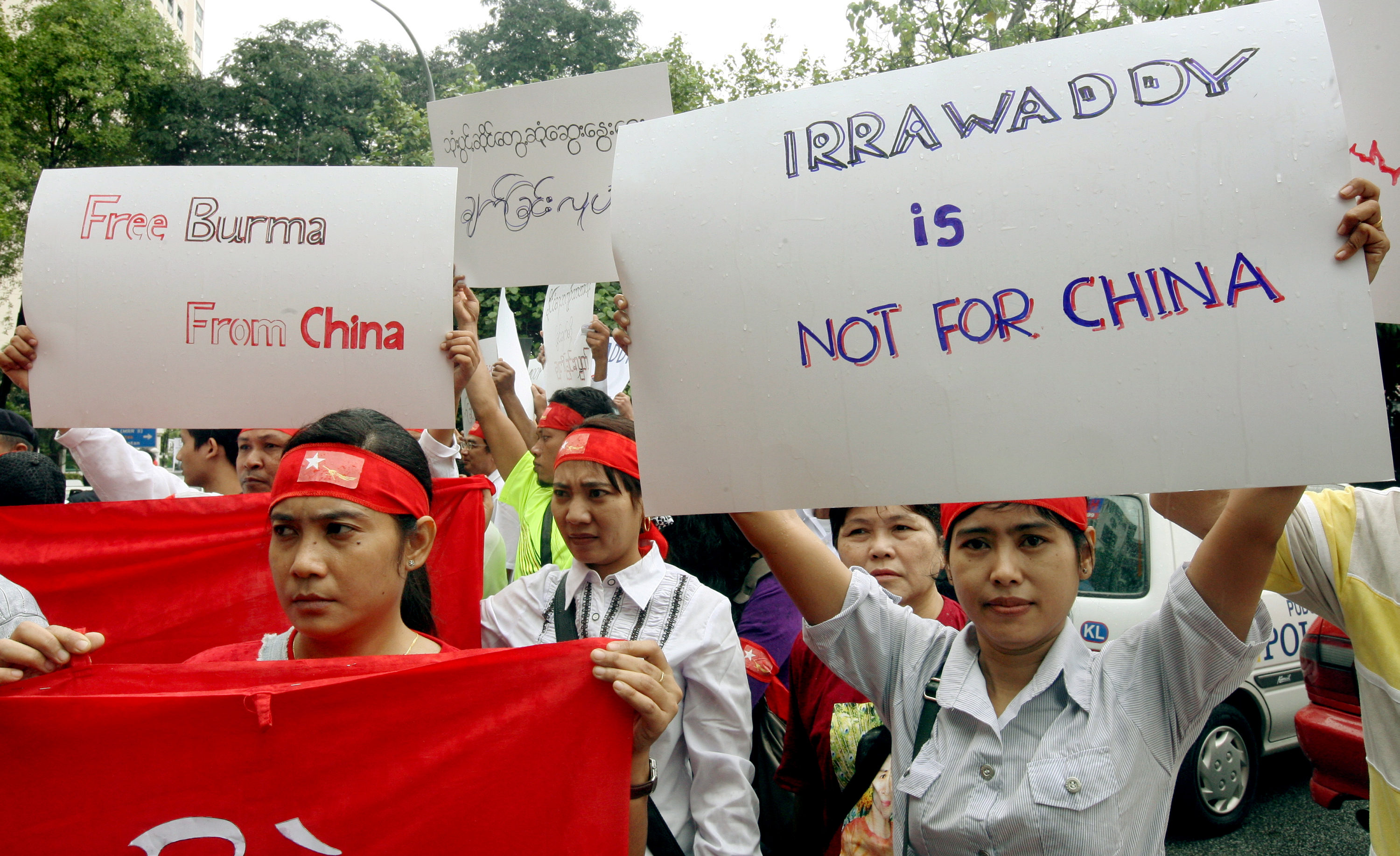 Burmese citizens in Malaysia protest a dam project in northern Myanmar.