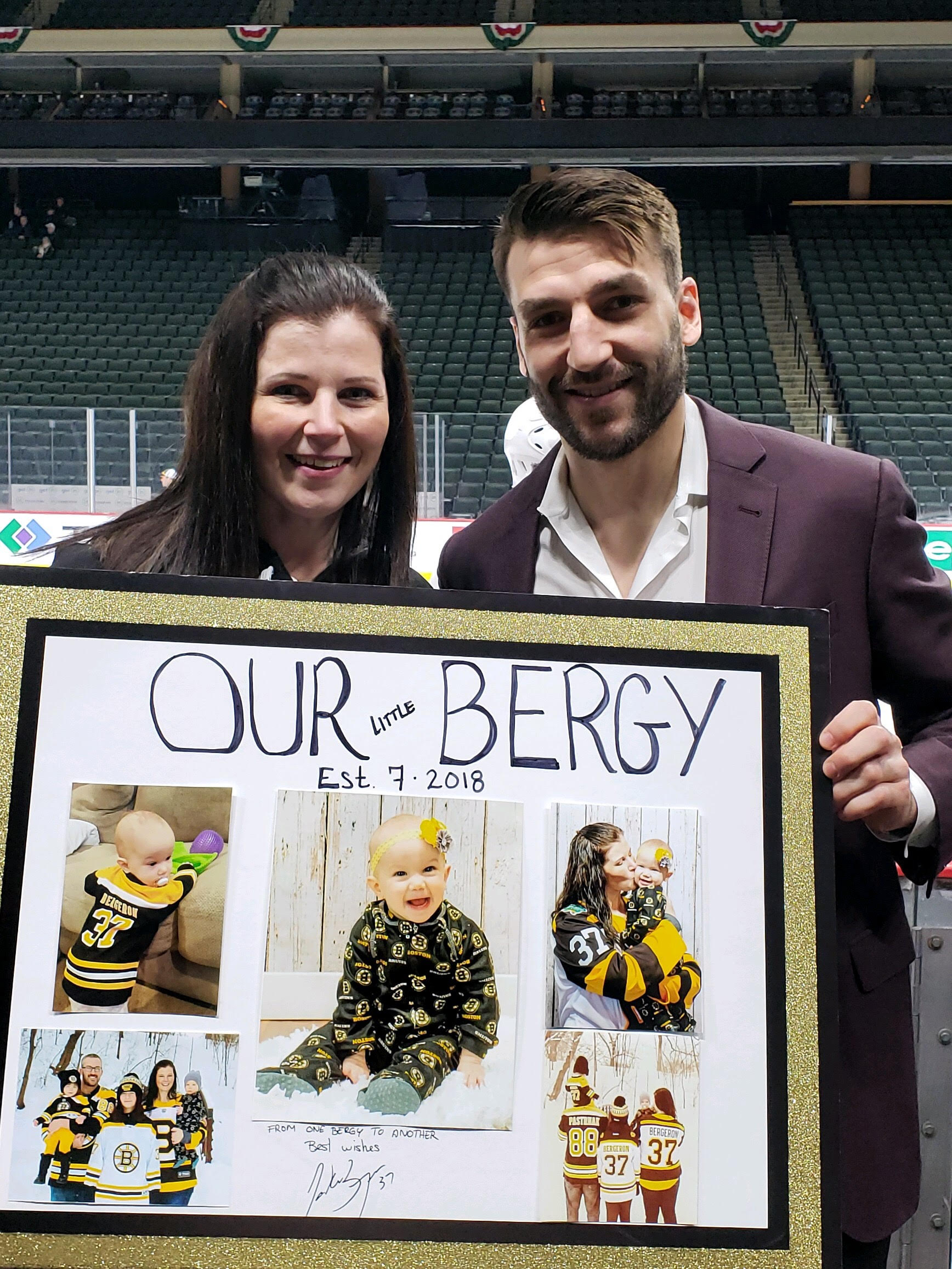 Meredith Dinsdale and Patrice Bergeron pose with photos of Dinsdale’s daughter.