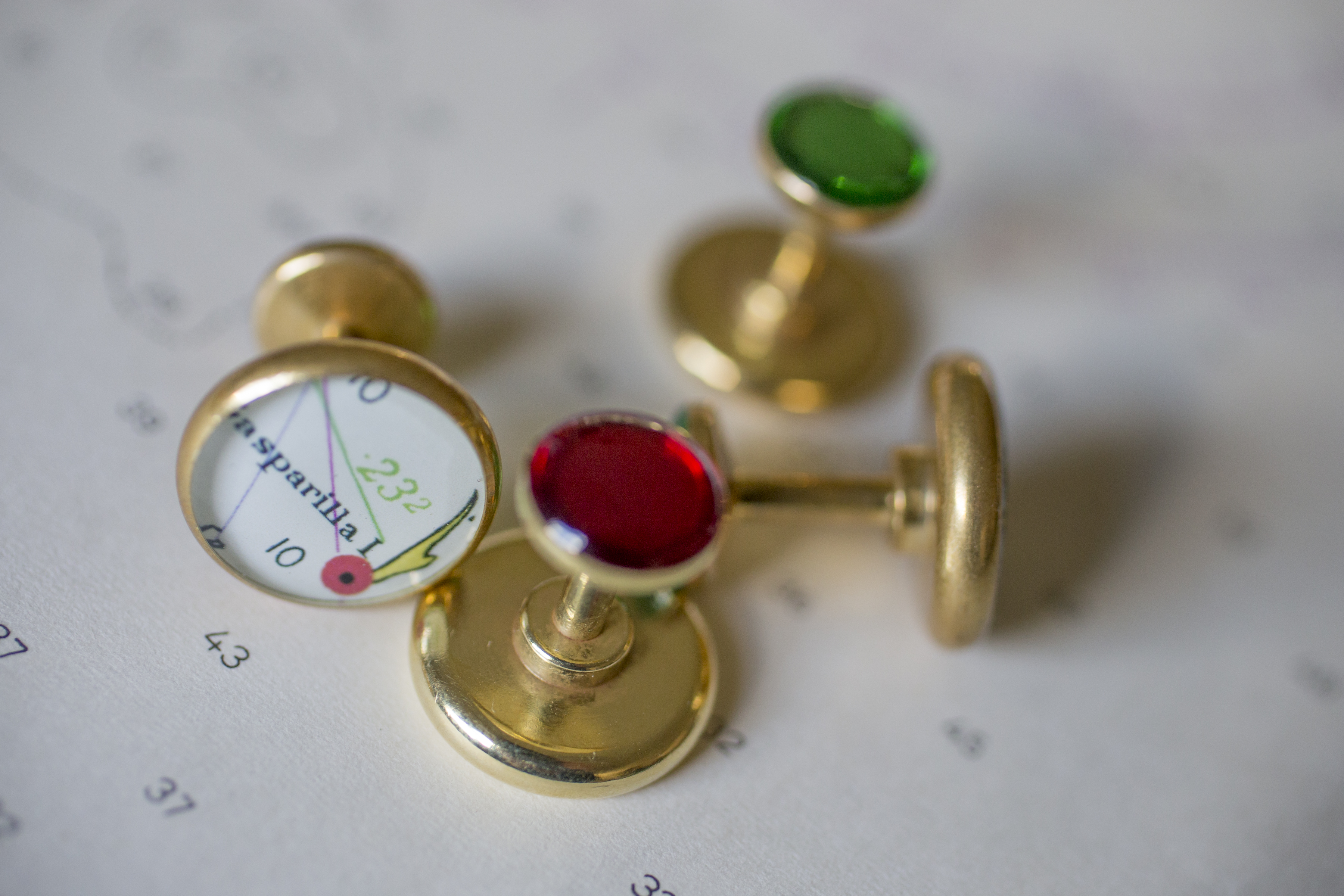 This pair of cufflinks from York River Traders has Gasparilla Island in Florida on the front. The backs are red for port and green for starboard.