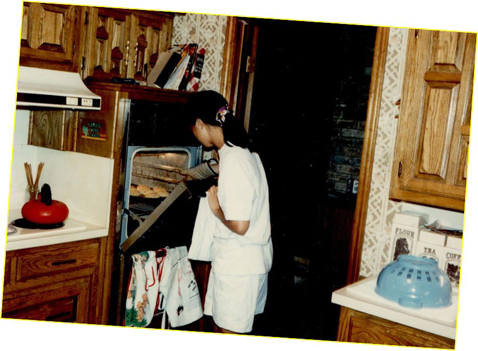 A teenage Chang baking cookies at home in Dallas around 1986.
