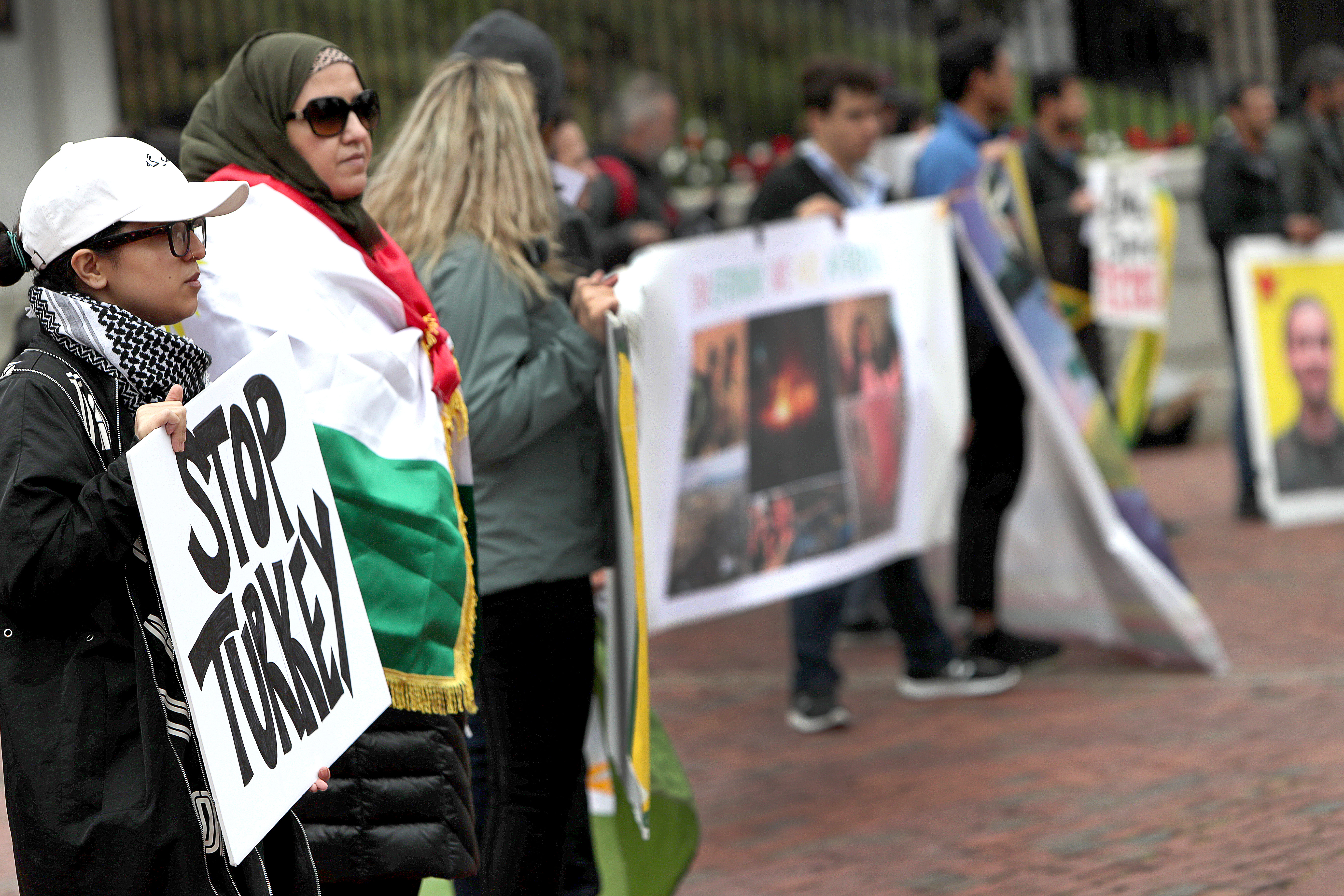 More than 20 people attended the event, which featured a Kurdish flag and speakers playing Kurdish music, and people holding signs that said “Free Kurdistan,” “Erdogan sponsors terrorism,” and “STOP TURKEY.”