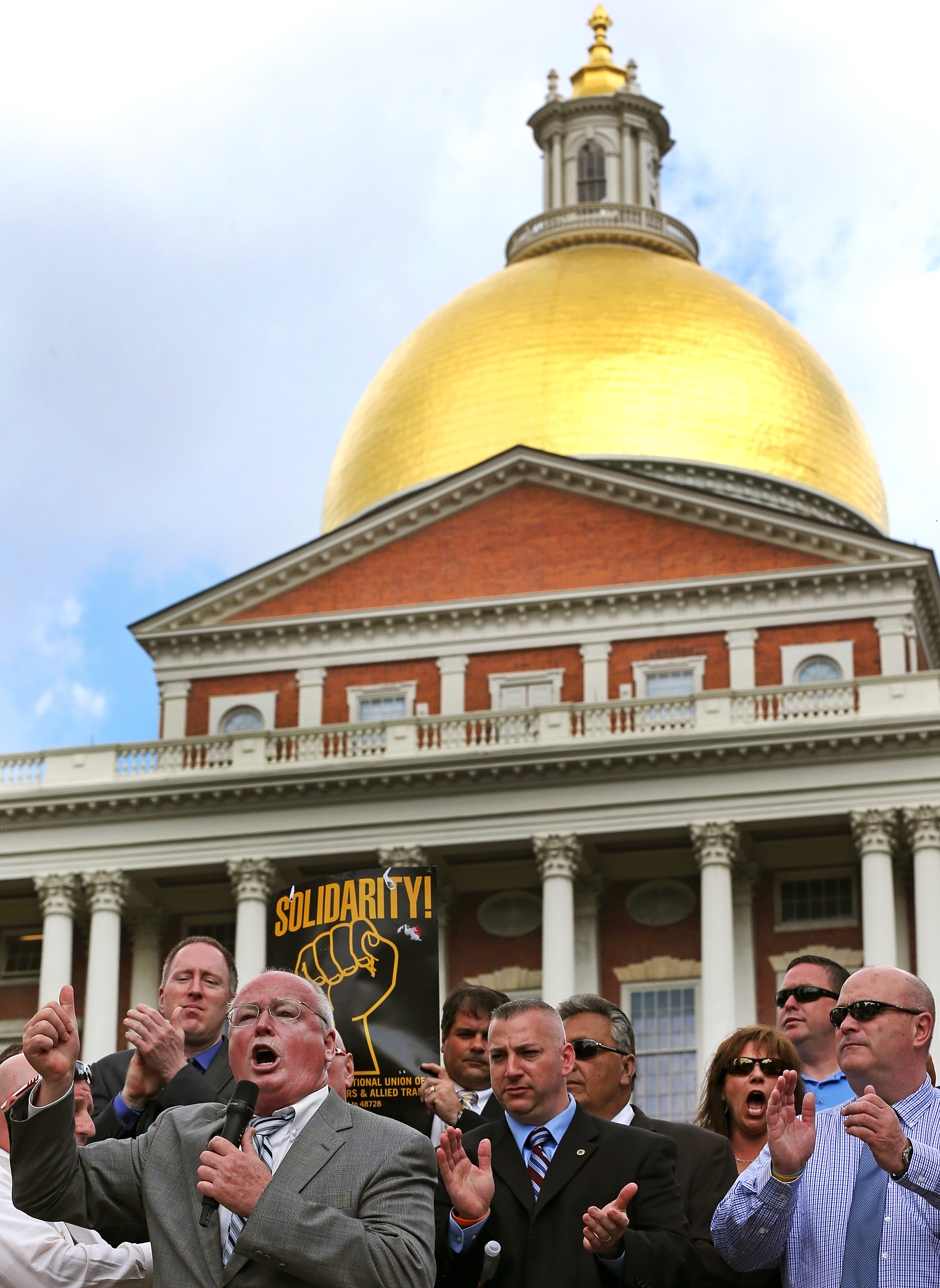 AFL-CIO President Steven Tolman spoke at an MBTA union workers rally at the State House in May.