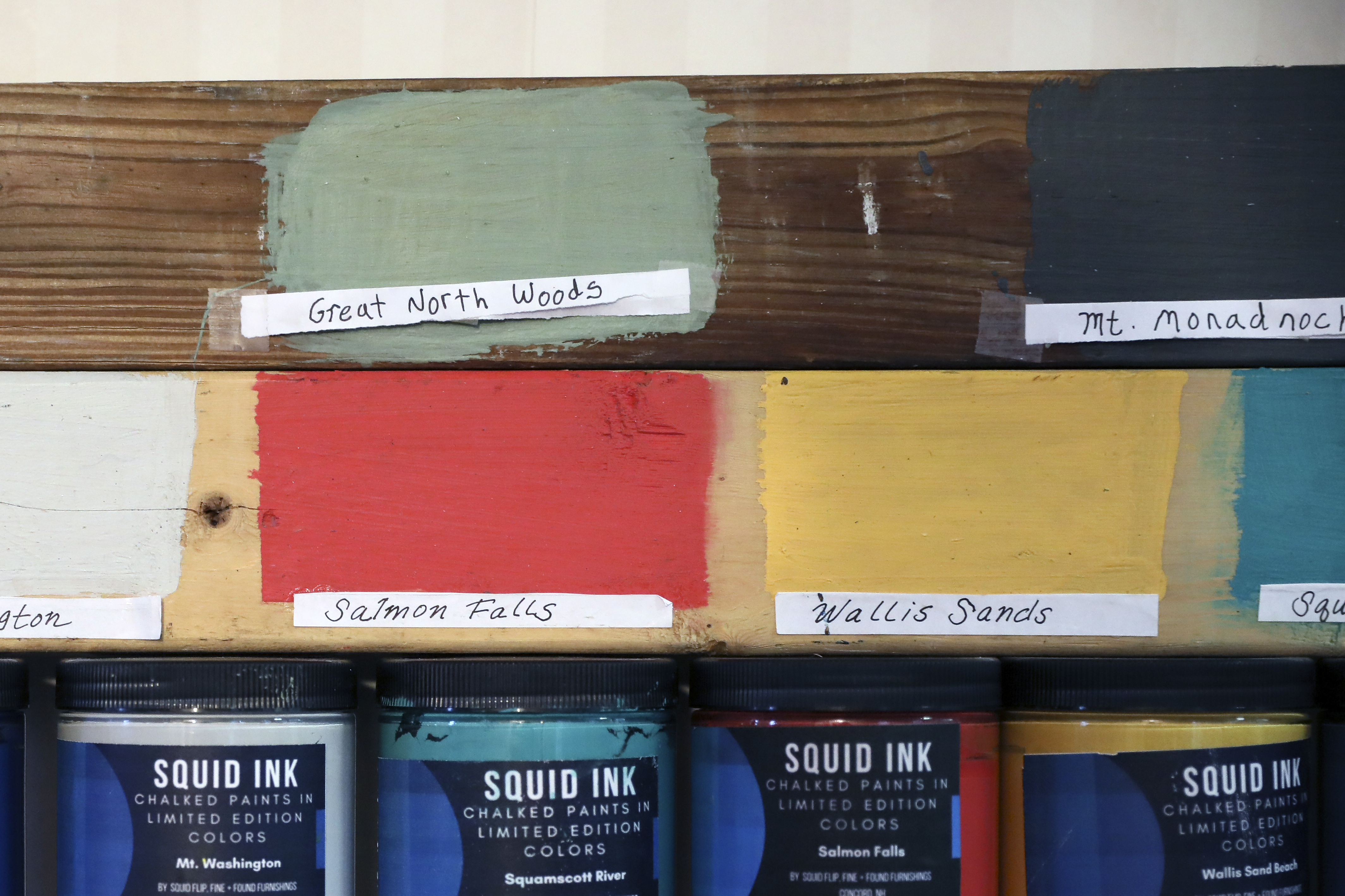 The shop carries seven shades of SquidInk paint that he makes with ingredients from a hardware store and uses to redo antique furniture.