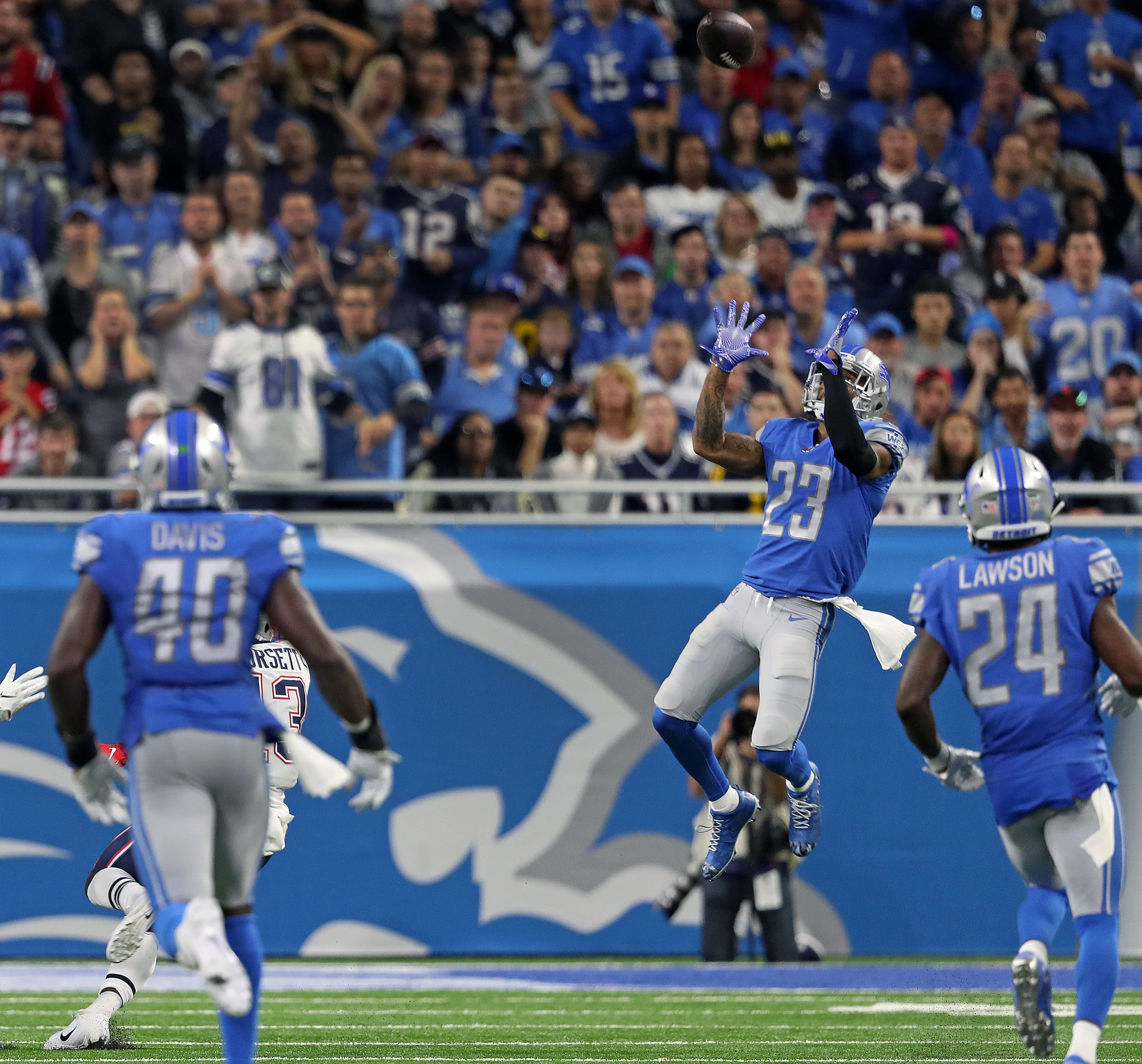 Lions cornerback Darius Slay (23) is the only player near the ball, as he intercepts a fourth quarter pass from Tom Brady.