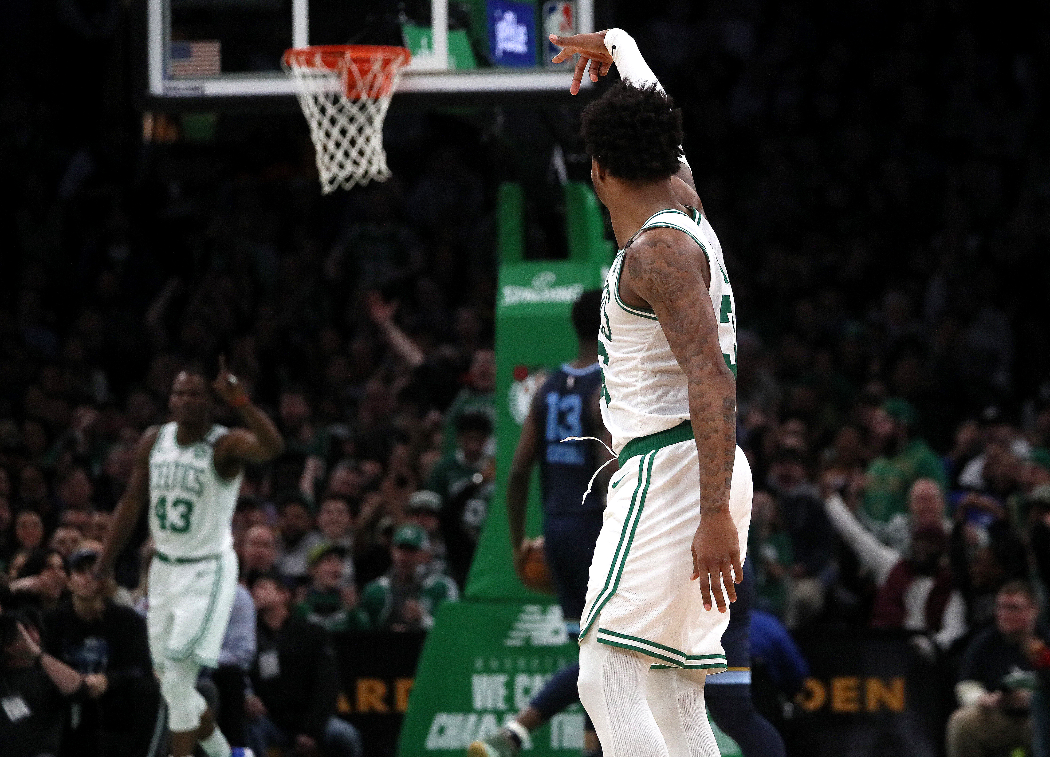 Marcus Smart signals to Javonte Green after his over the shoulder no look pass for the assist on Green's basket during the second quarter of Wednesday’s game.