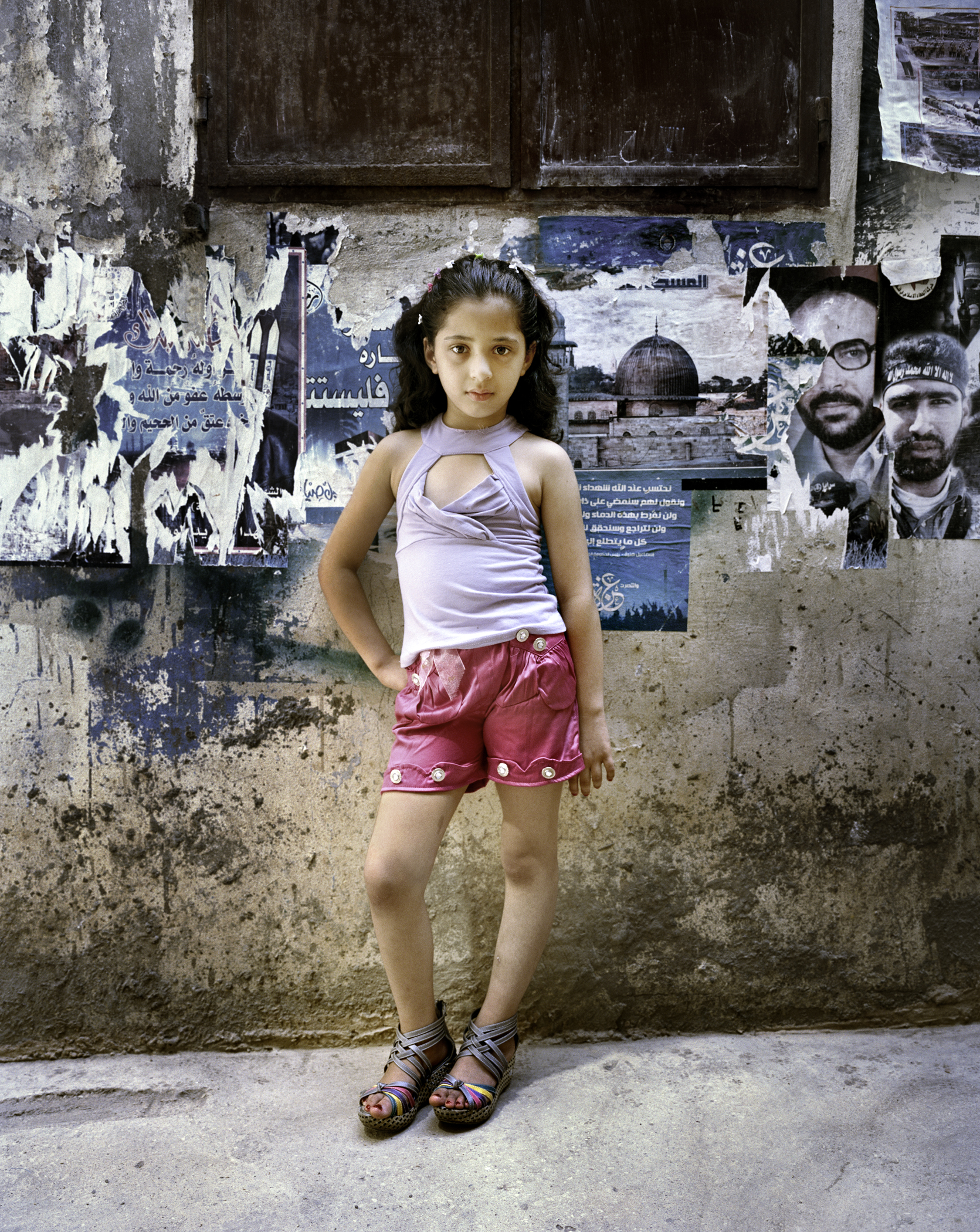 Rania Matar’s photograph “Dania, 9, Bourj El Barejneh Refugee Camp, Beirut, Lebanon” at Carroll and Sons.