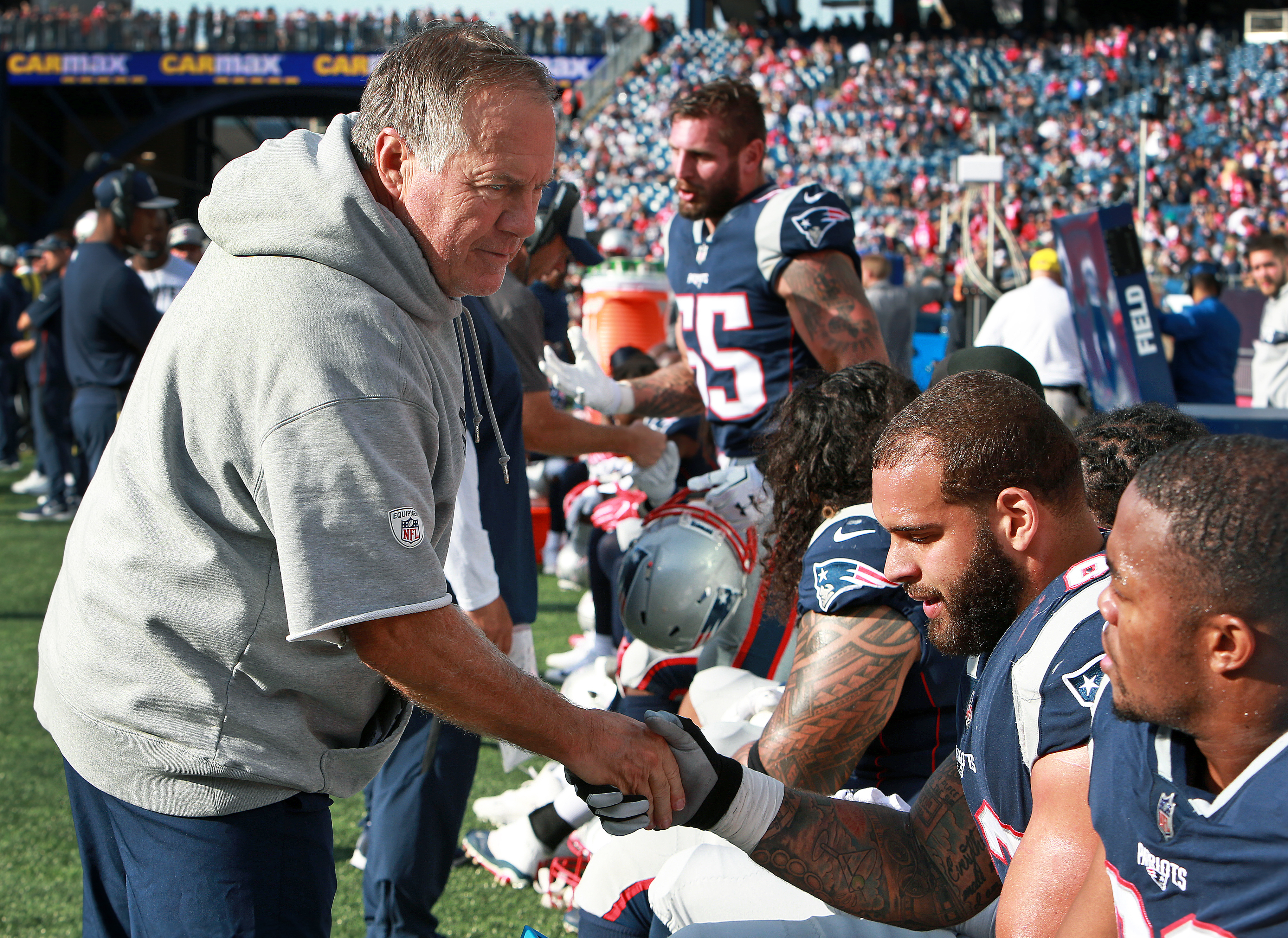 Patriots head coach Bill Belichick shook hands and congratulated memebers of the New England defense as the clocked ticked down in their 38-7 victory.
