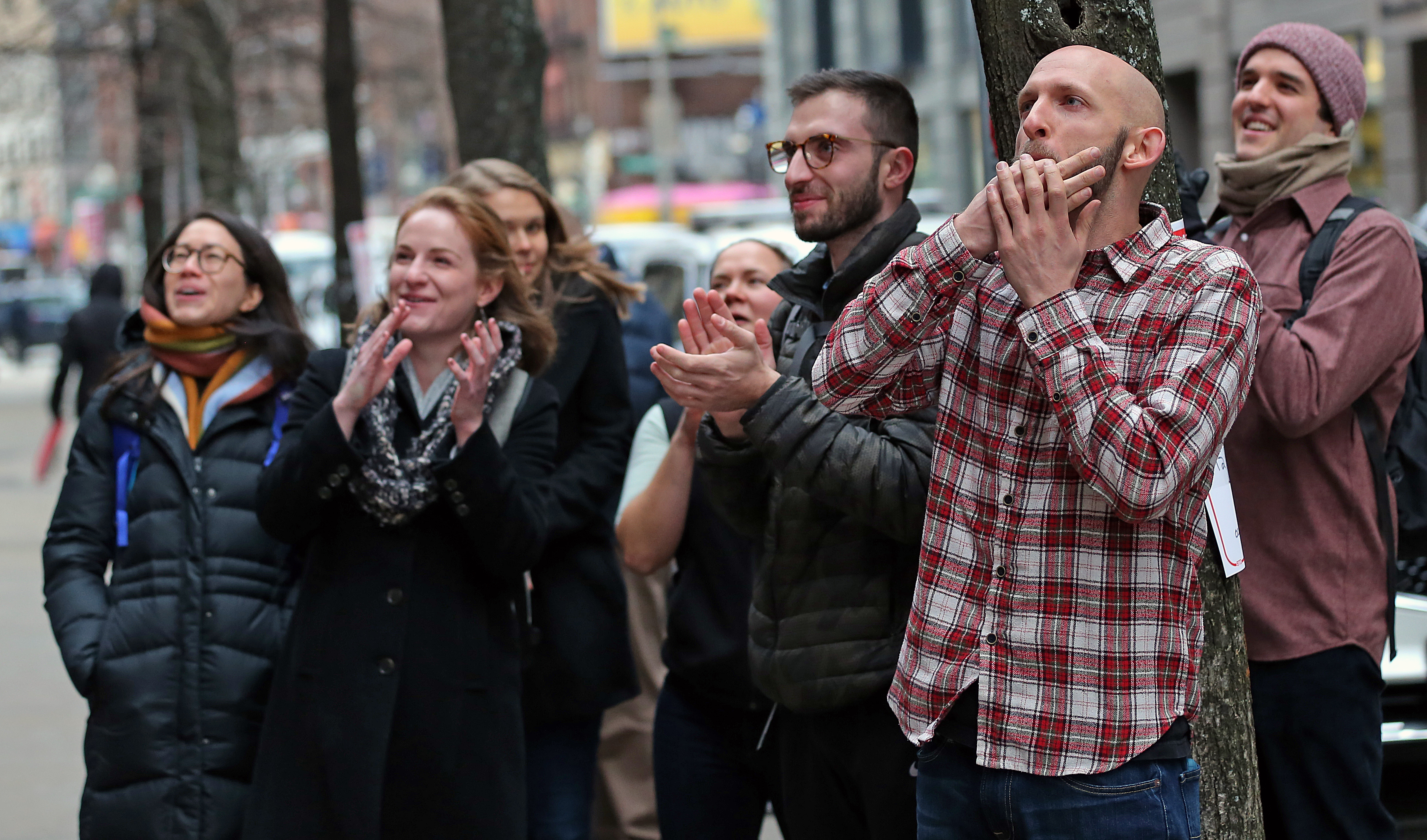 A crowd at Tufts’s Boston health sciences campus cheered as a sign with the Sackler name was covered over.