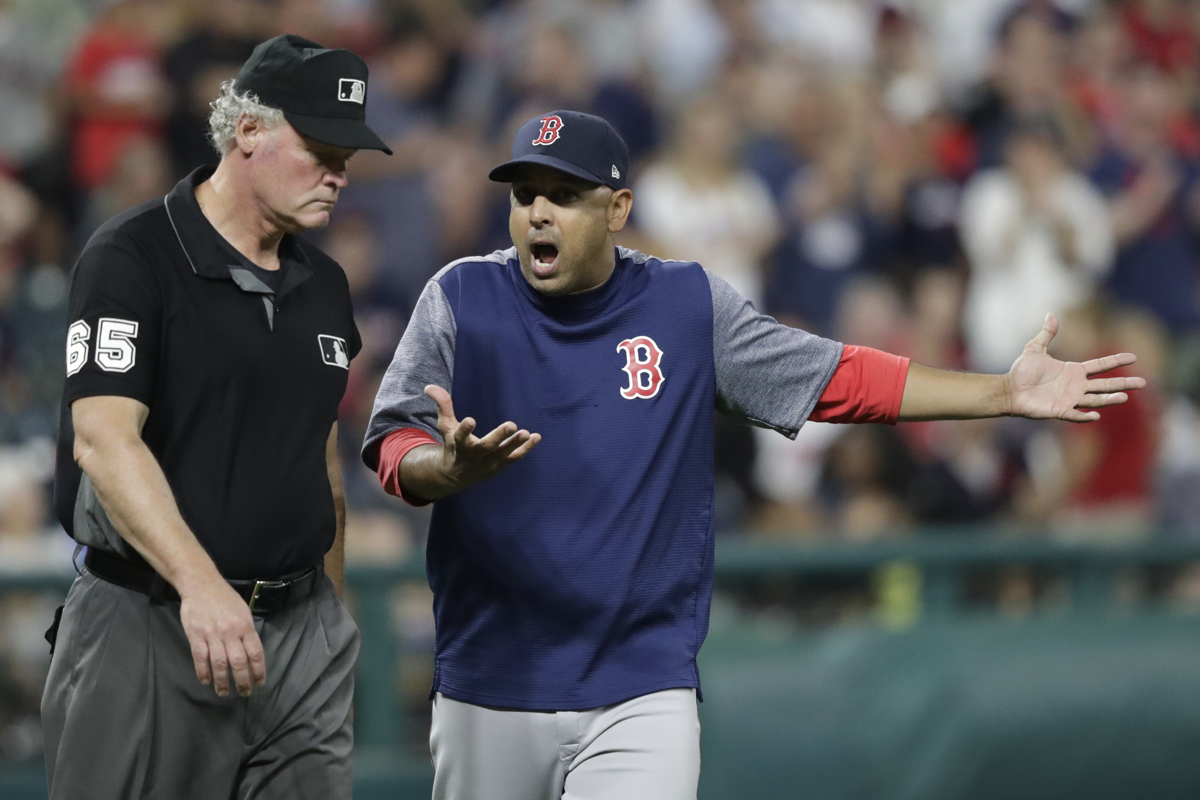 Red Sox manager Alex Cora (right) unsuccessfully argues a call with umpire Ted Barrett on a play in the eighth inning.
