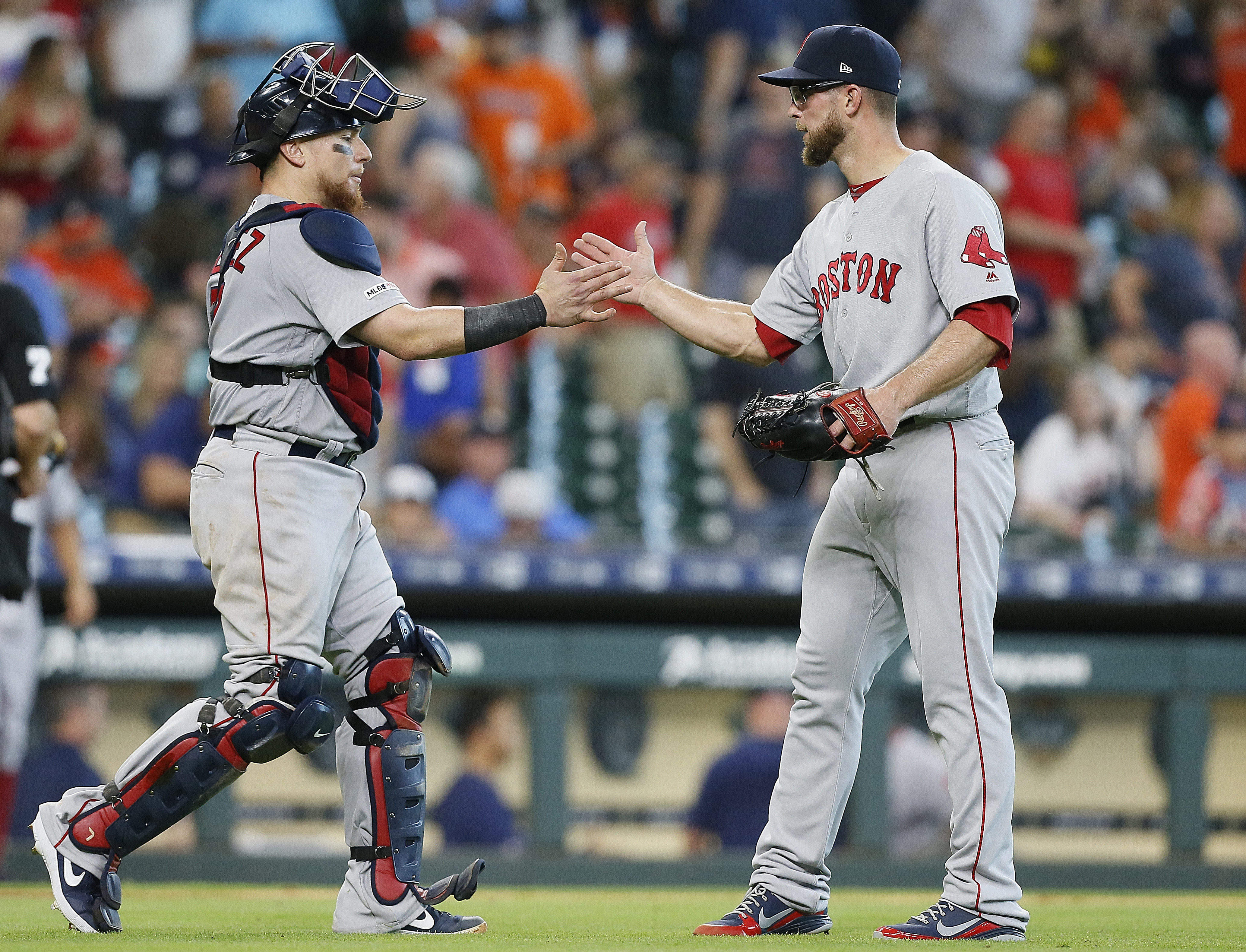 Red Sox catcher Christian Vazquez shakes hands with Marcus Walden after the final out of the game. It marked Walden’s first save of the season.