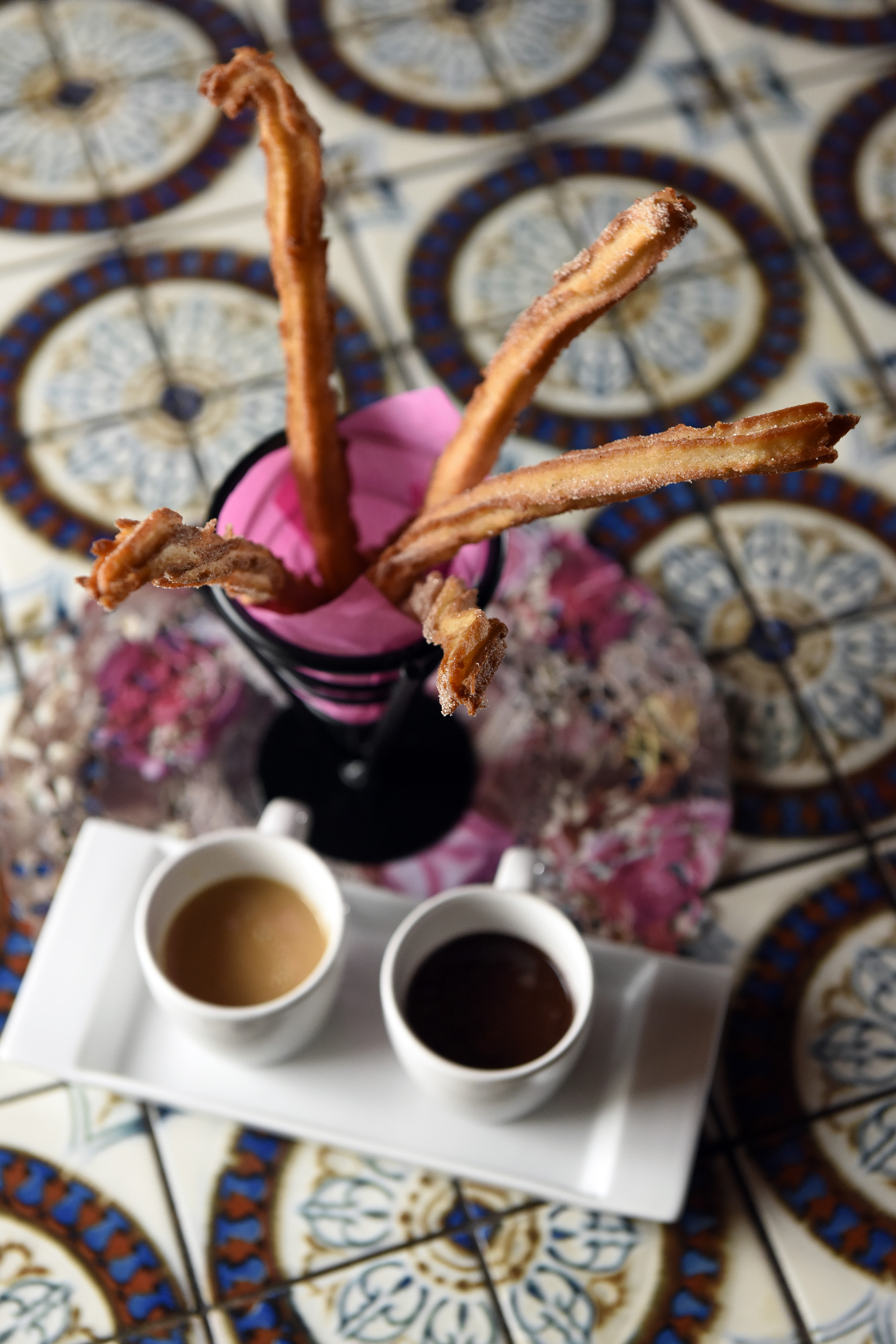 Churros, with warm chocolate sauce and dulce de leche.