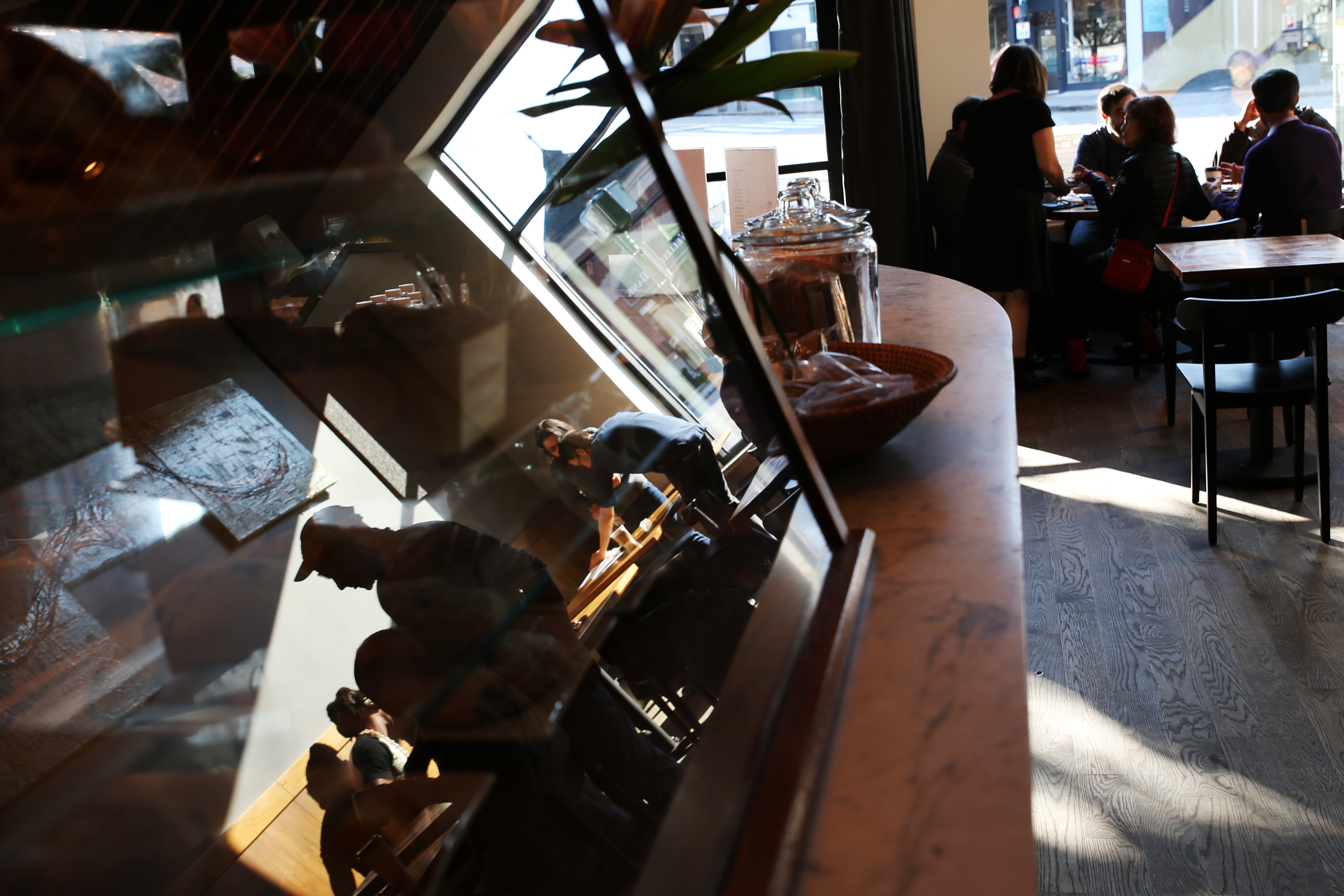 Guests were reflected in a display case at the restaurant.