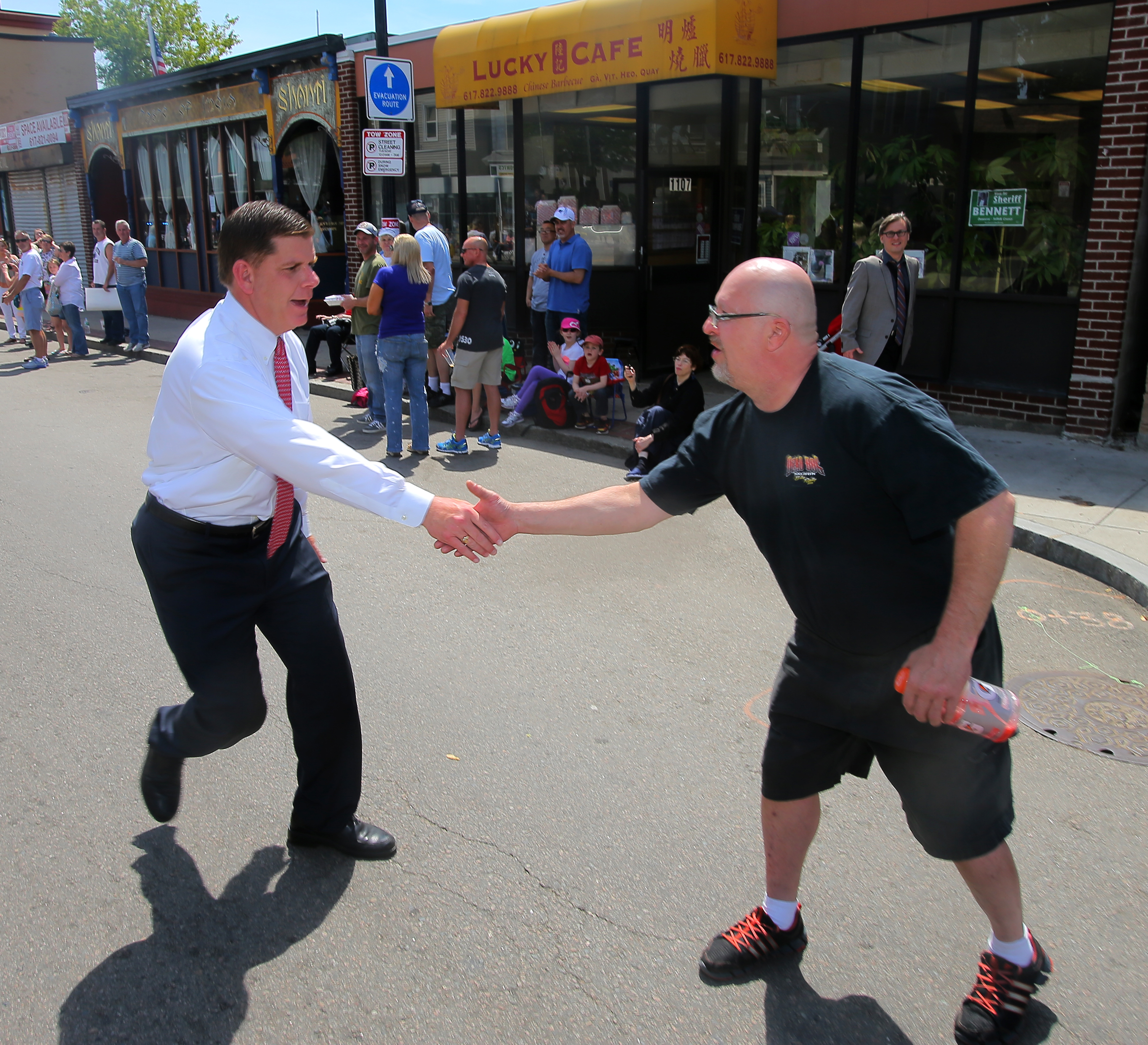 Mayor Martin J. Walsh greeted Mark Fitzpatrick on the Dorchester Day Parade route.