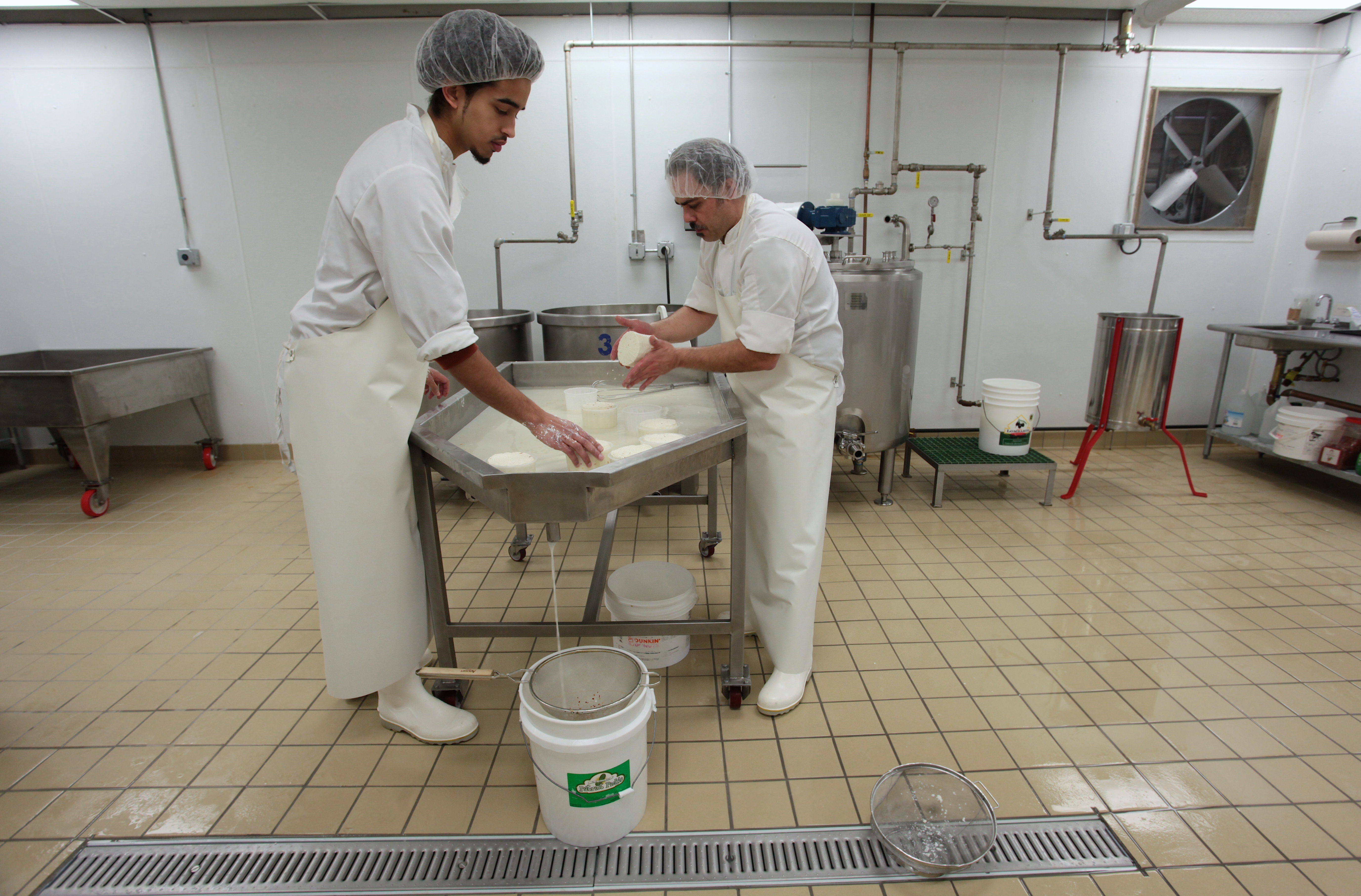 Hakim Truitt (left) and Luca Mignogna make primo sale at small operation in Amesbury.