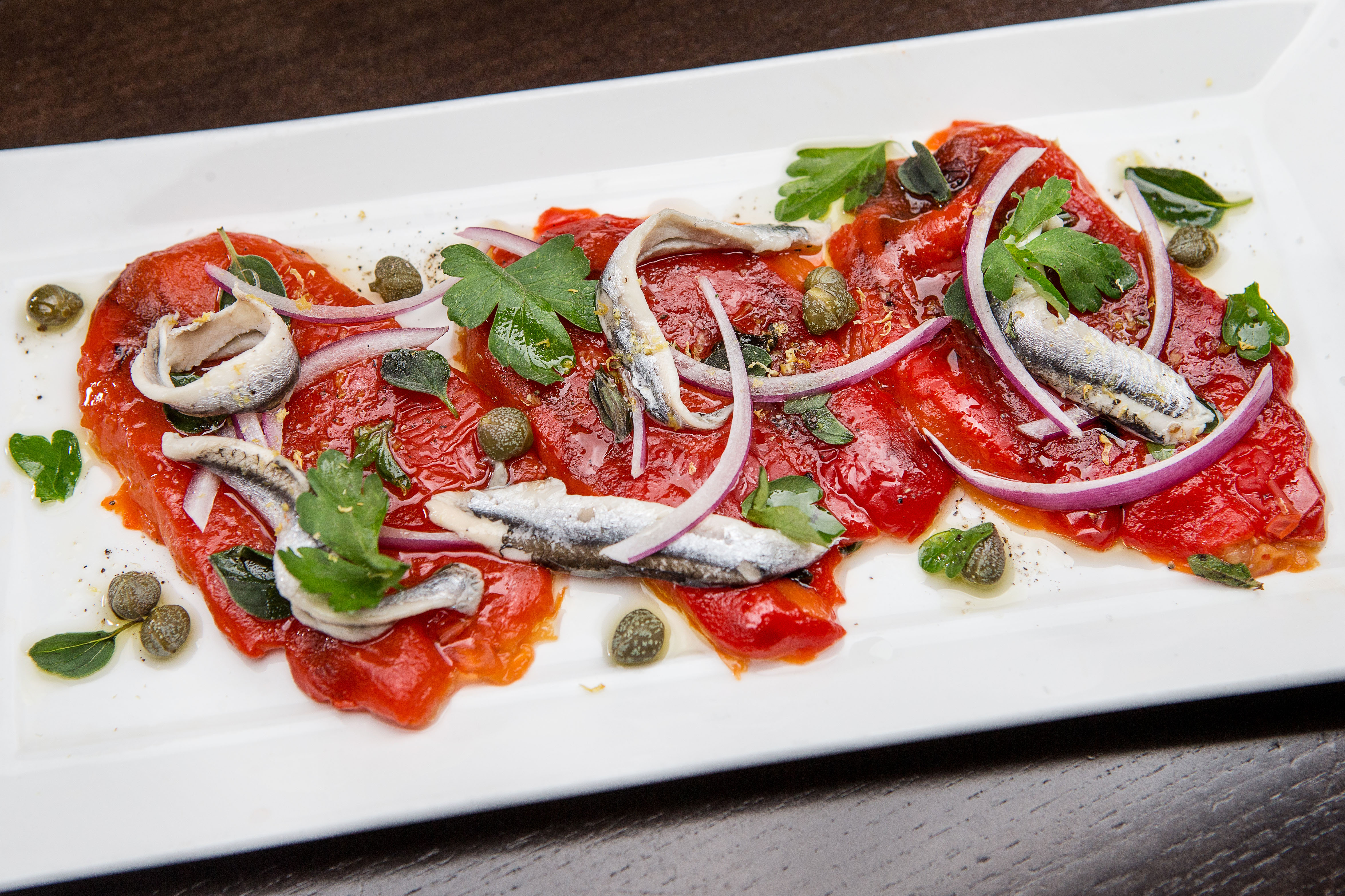 Roasted peppers with anchovies at Doretta Taverna & Raw Bar.