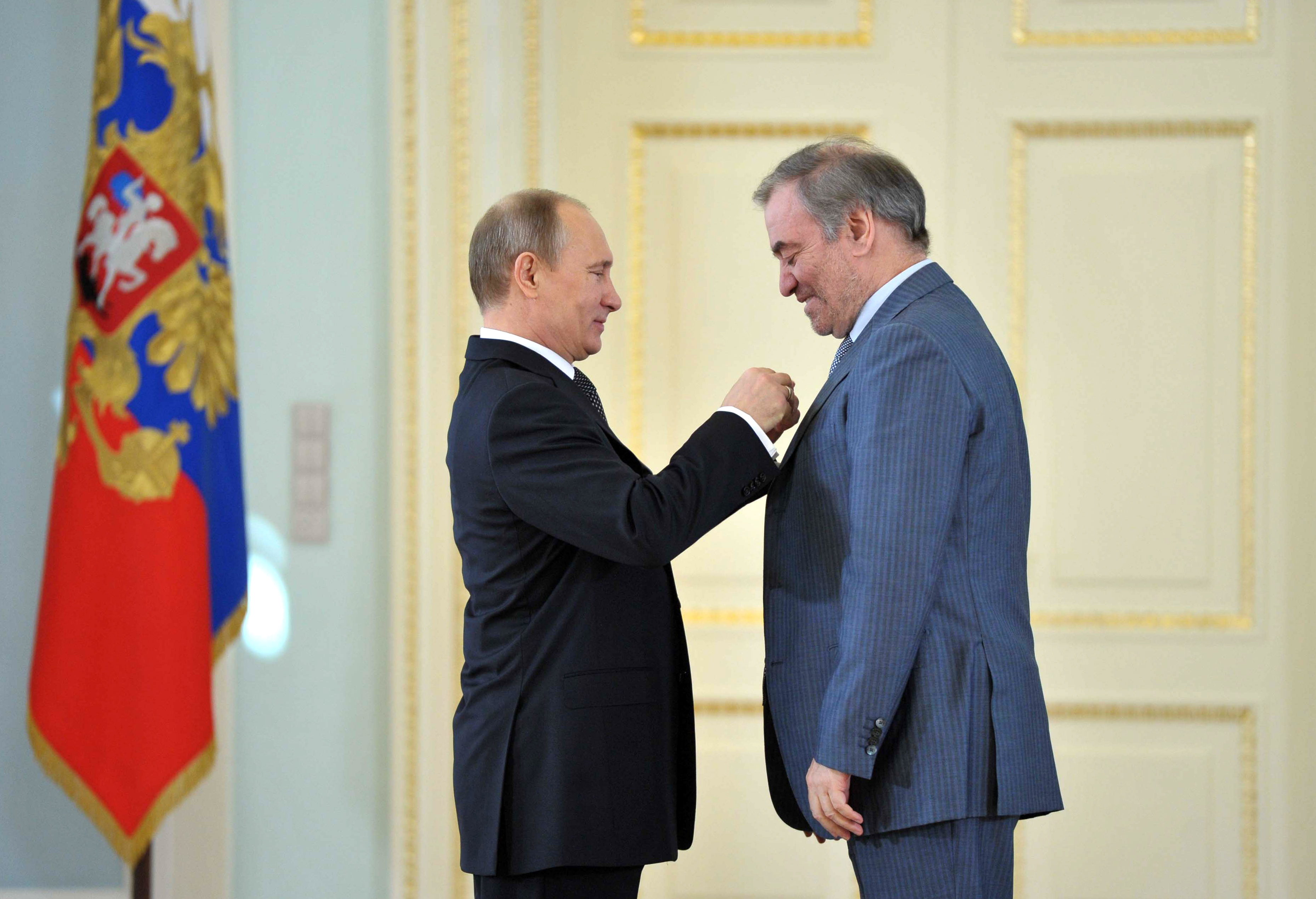 President Vladimir Putin (left) honored conductor Valery Gergiev with a Hero of Labour award during a ceremony in St. Petersburg.