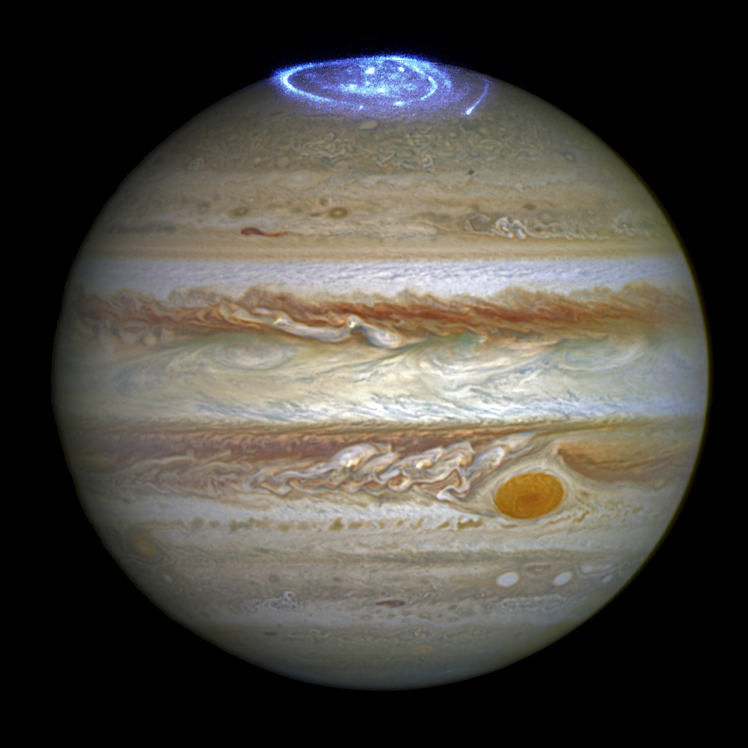 Auroras created by high-energy particles are seen on a pole of the planet Jupiter.