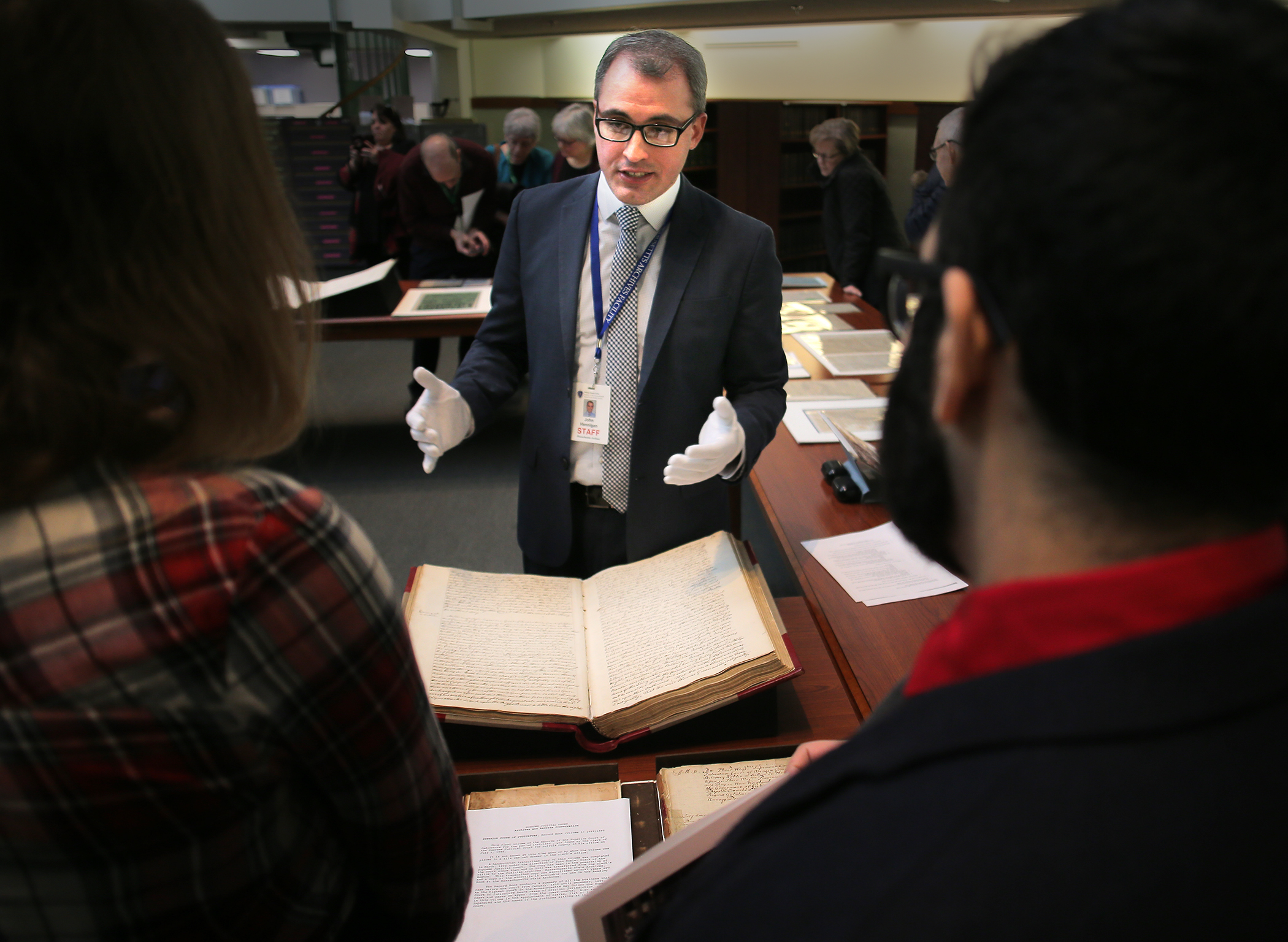 John Hannigan, head of reference services, explained the story behind an item to some visitors of the archives.