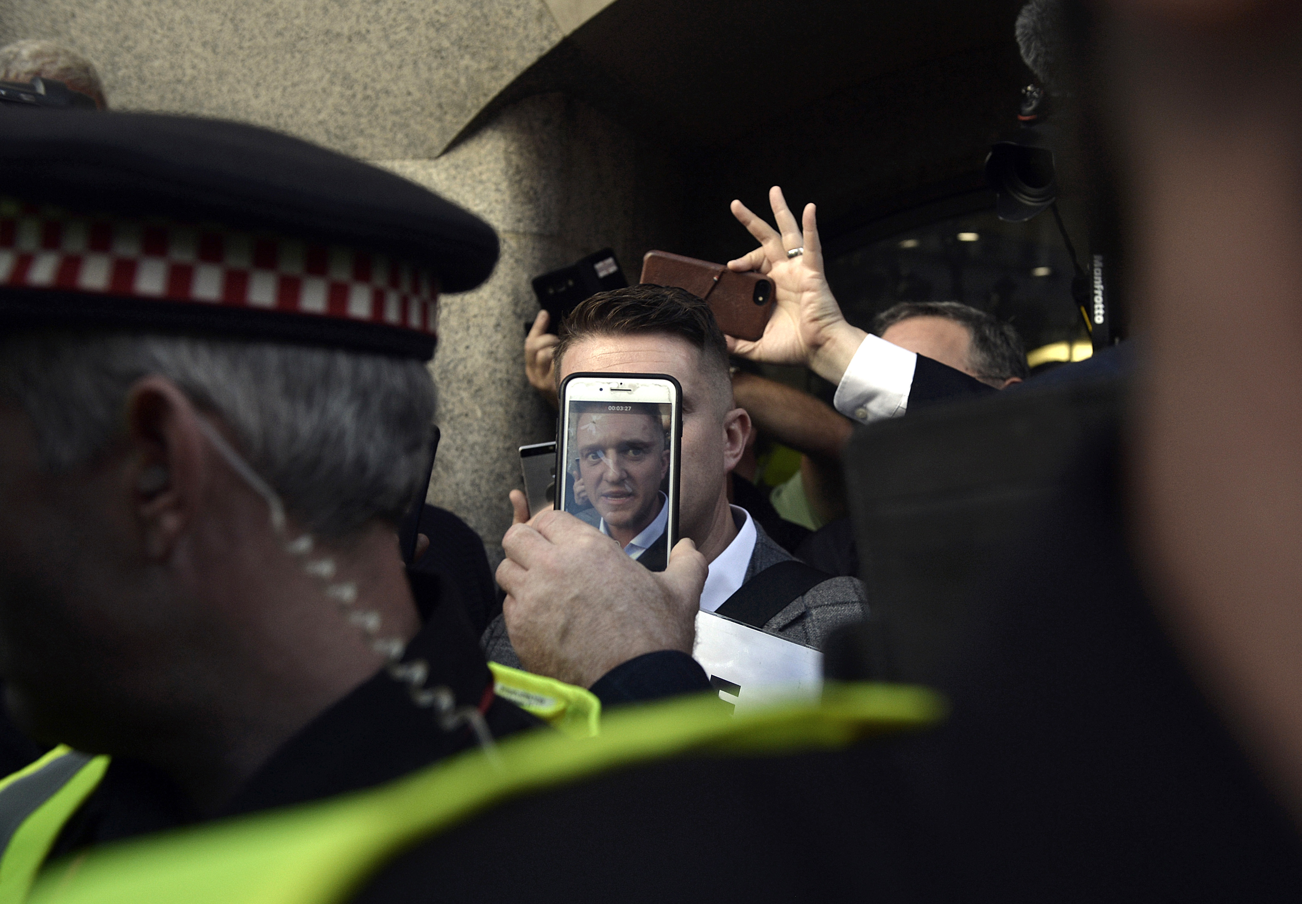 Tommy Robinson left court in London. His rise to right-wing stardom has been bolstered by unofficial support from former Trump aide Steve Bannon and Donald Trump Jr.