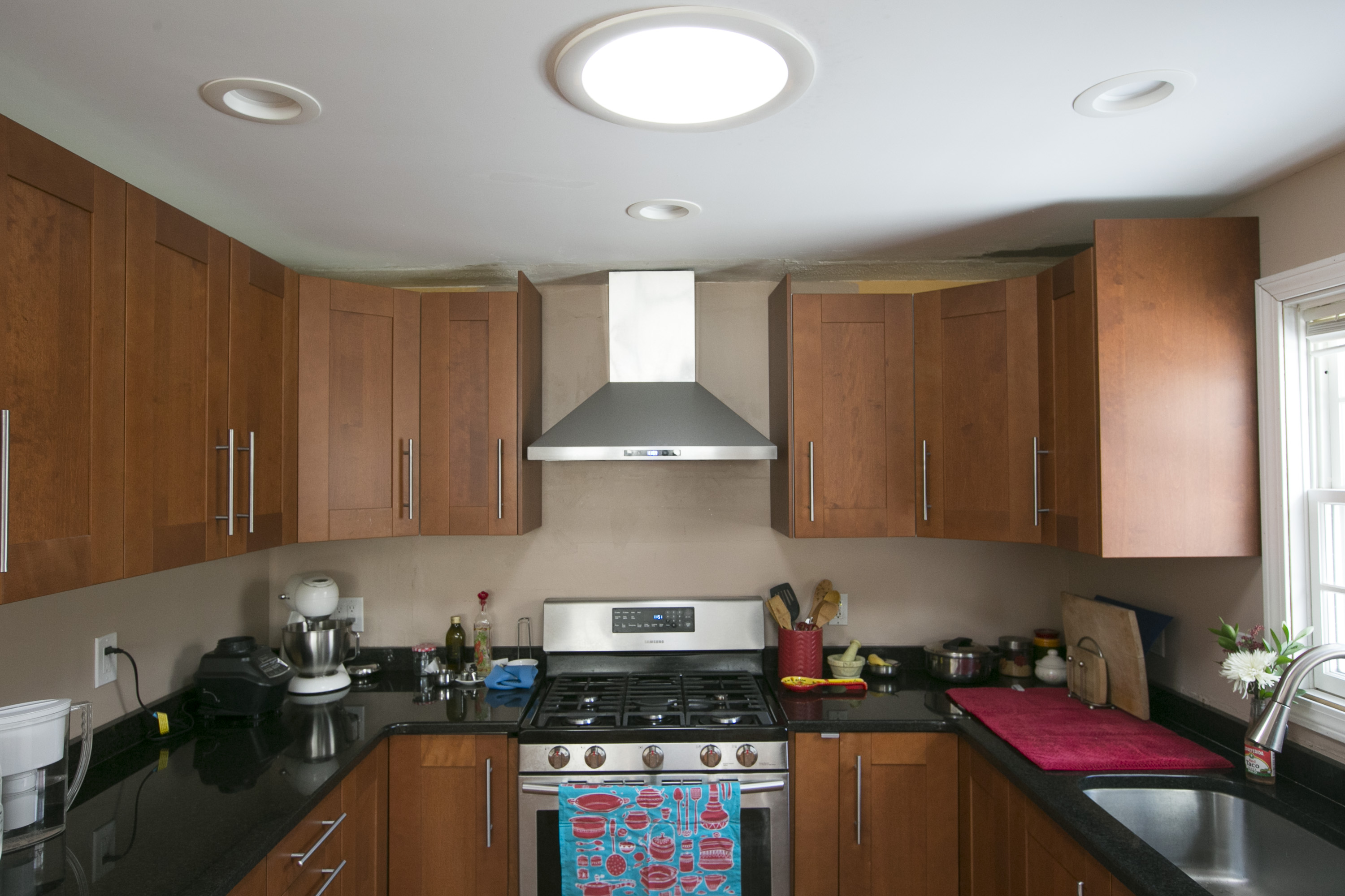 A solar tube (top) allows natural light to fill the kitchen of the Cowlagis.