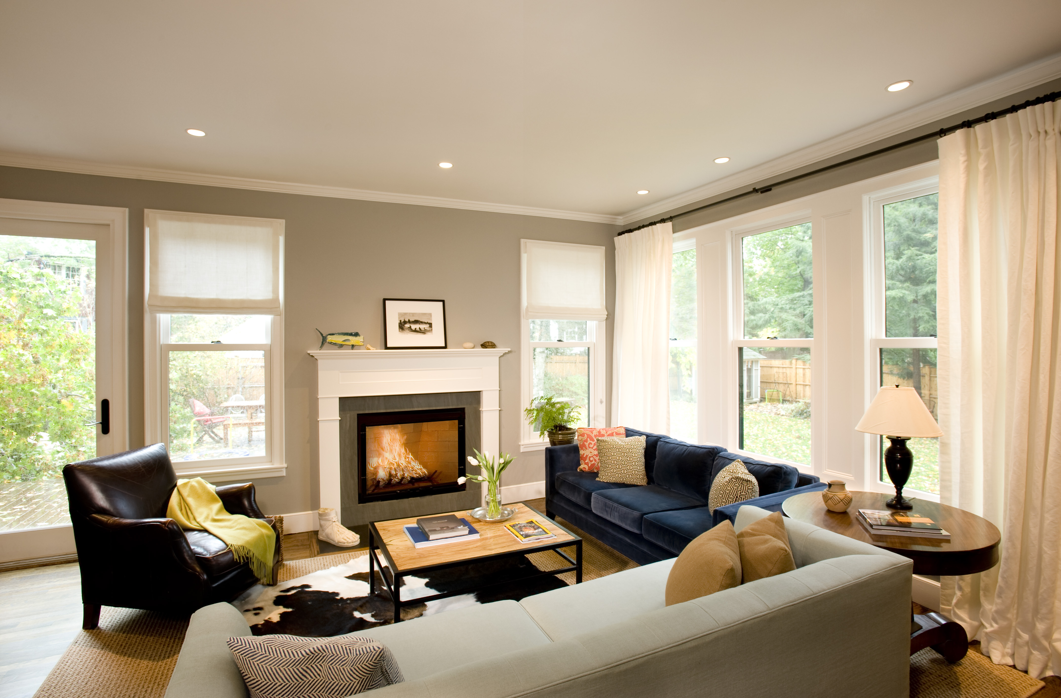 <span id="U802256556666TL" style=" font-family: 'PoynterGothicText Black'; font-weight: normal; font-style: normal; text-transform: uppercase; ;">Living room</span>Soft gray walls provide a backdrop for jewel-toned furnishings including a cobalt-blue velvet sofa and another one upholstered in icy blue woven linen. Playful pillows in an array of textures can be mixed and matched.