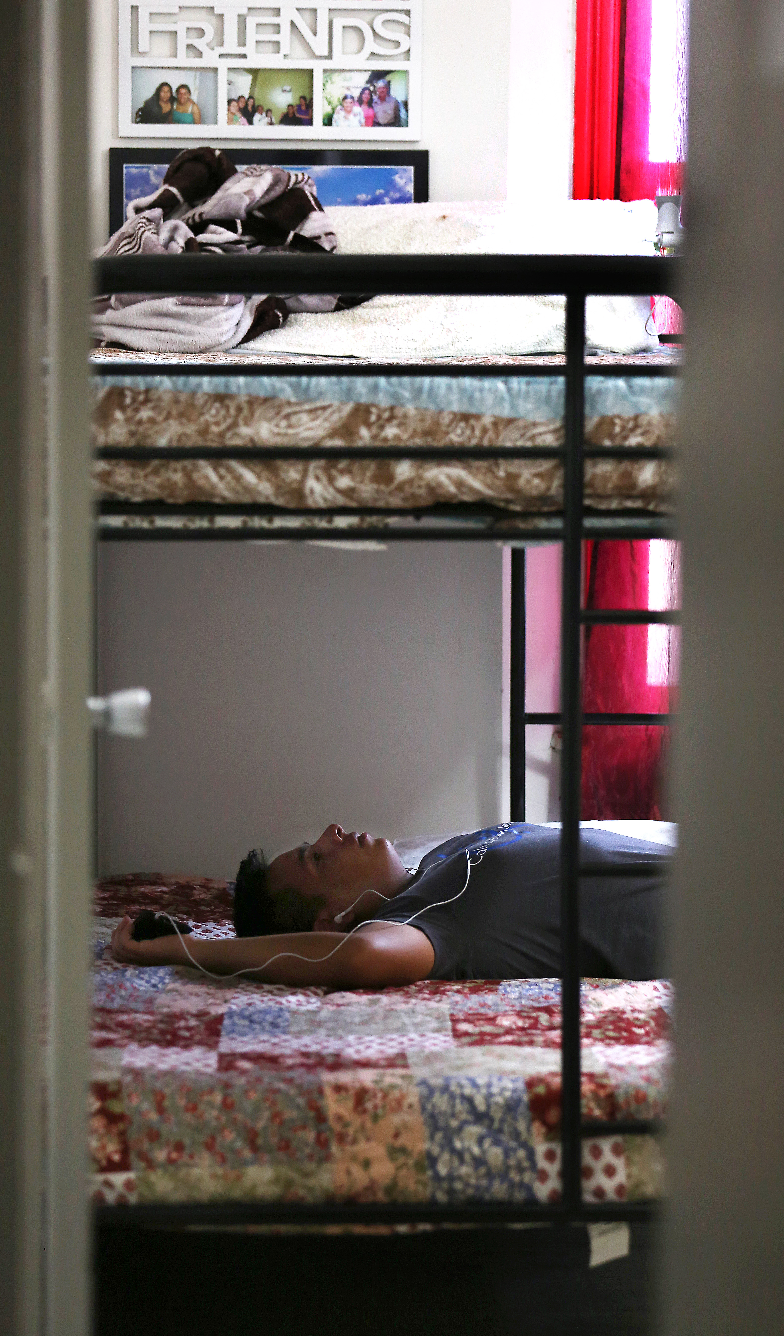 Jorge listened to music in his uncle’s apartment. He’s determined to study and learn English so he can succeed in this new country.
